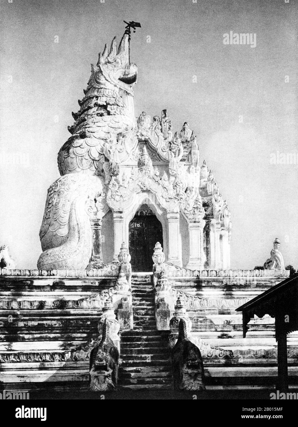 Burma/Myanmar: The dragon-shaped Ava Pagoda, c.1920s.  Ava was capital of Burma from 1364 to 1841 and was founded by King Thadominbya on an artificial island at the confluence of the Irrawaddy and the Myitnge created by digging a canal linking the two rivers. Prior to this, Sagaing had been capital, but after Sagaing fell to the Shan, the court moved across the river to Ava.  The culture of Pagan was revived and a great age of Burmese literature ensued. The kingdom lacked easily defensible borders, however, and was overrun by the Shan in 1527. Stock Photo