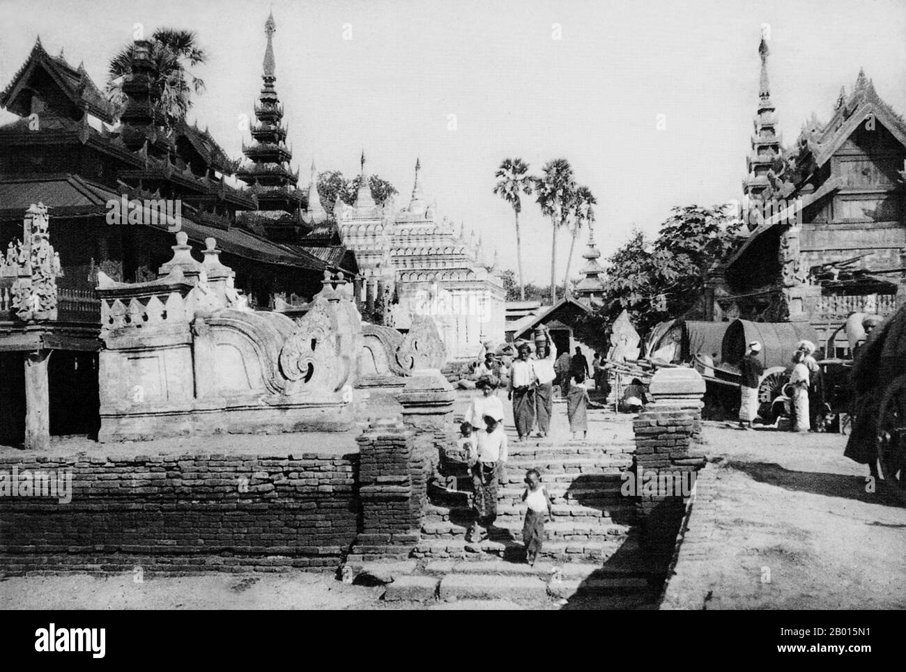 Burma/Myanmar: The Ananda Pagoda in Bagan, Upper Burma, c. 1920s.  Perhaps the highest revered temple in Bagan, the Ananda Pagoda was built in 1105 CE during the reign of King Kyanzittha (1084–1113) of the Bagan Dynasty. It is one of four surviving original temples of Bagan (also called Pagan). The temple layout is in a cruciform with several terraces leading to a small pagoda at the top covered by an umbrella (‘hti’).  The Buddhist temple houses four standing Buddhas—facing east, north, west and south. The temple is an architectural wonder in a fusion of Mon and adopted Indian style. Stock Photo