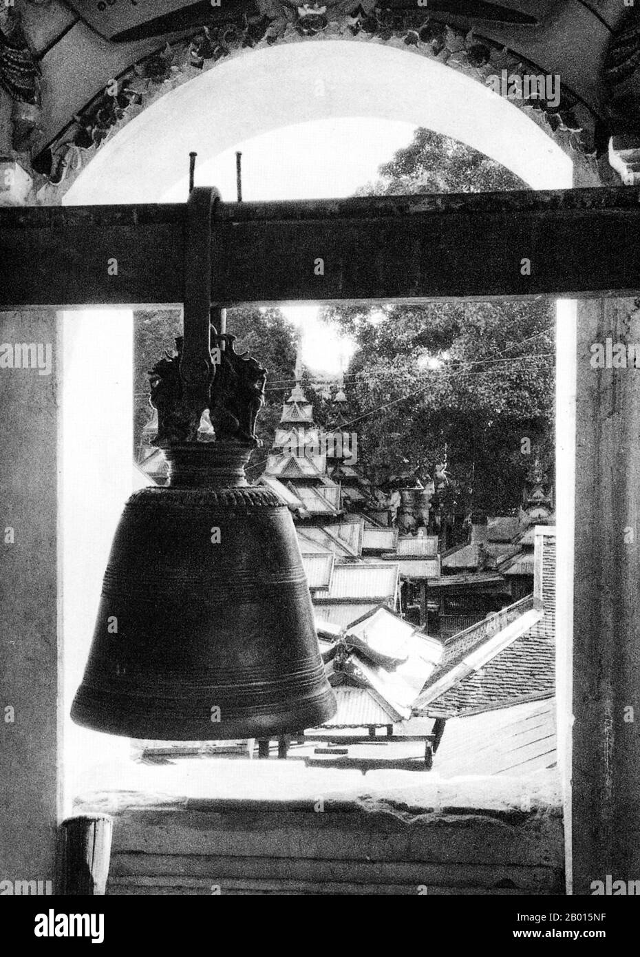 Burma/Myanmar: A pagoda bell in a Buddhist monastery in Monywa, Upper Burma, c. 1920s.  The Burmese city of Monywa is in Sagaing Division, located 136 km northwest of Mandalay on the eastern bank of the River Chindwin.  Legend attributes the first Buddhist doctrine in Burma to 228 BCE when Sohn Uttar Sthavira, one of the royal monks to Emperor Ashoka the Great of India, came to the country with other monks and sacred texts. However, the era of Buddhism truly began in the 11th century after King Anawrahta of Pagan (Bagan) was converted to Theravada Buddhism. Stock Photo
