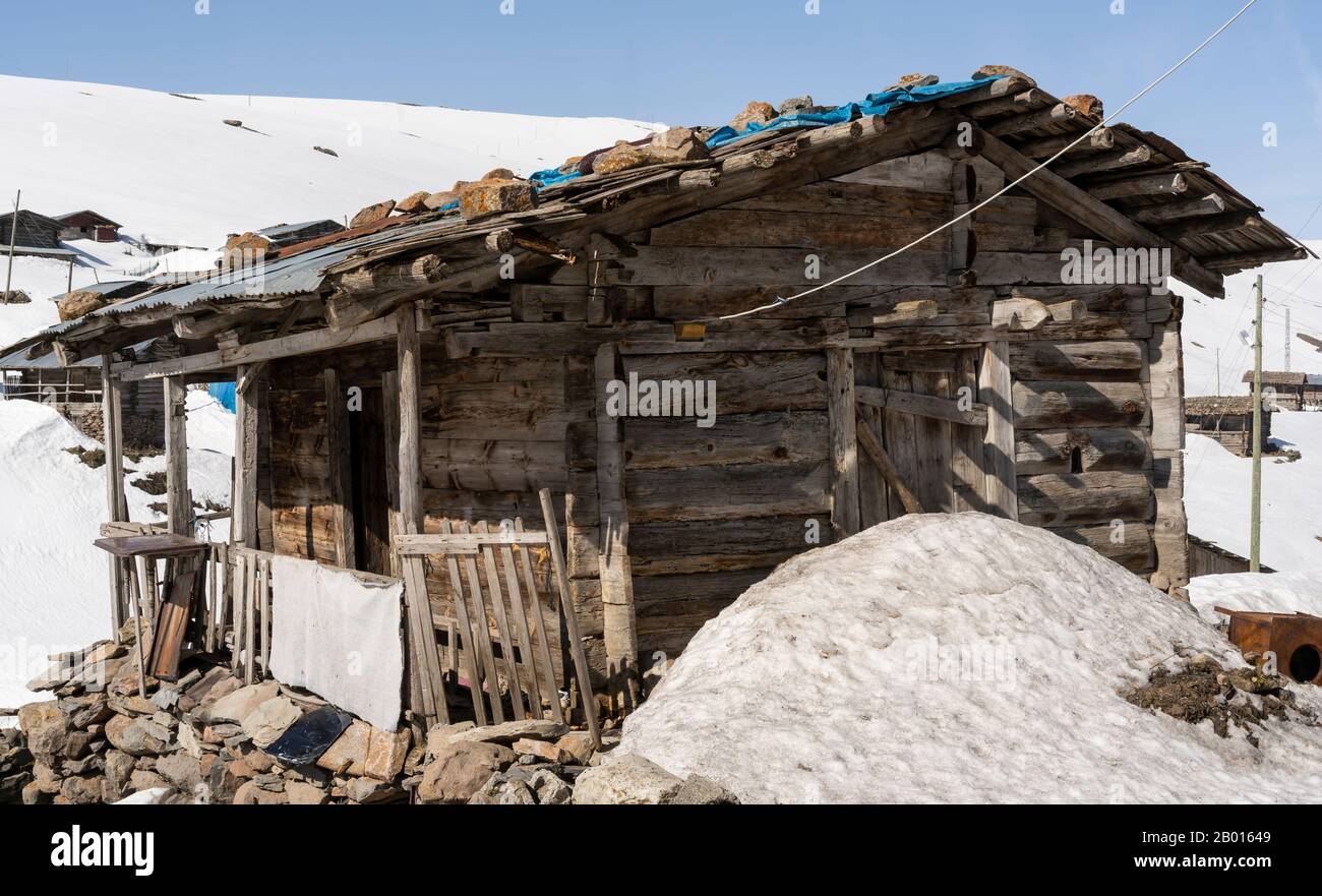 Koprulu, Turkey - May 9, 2019: Small village of Koprulu in the snow with wooden houses and cabins in a snowy valley in Turkey. Stock Photo