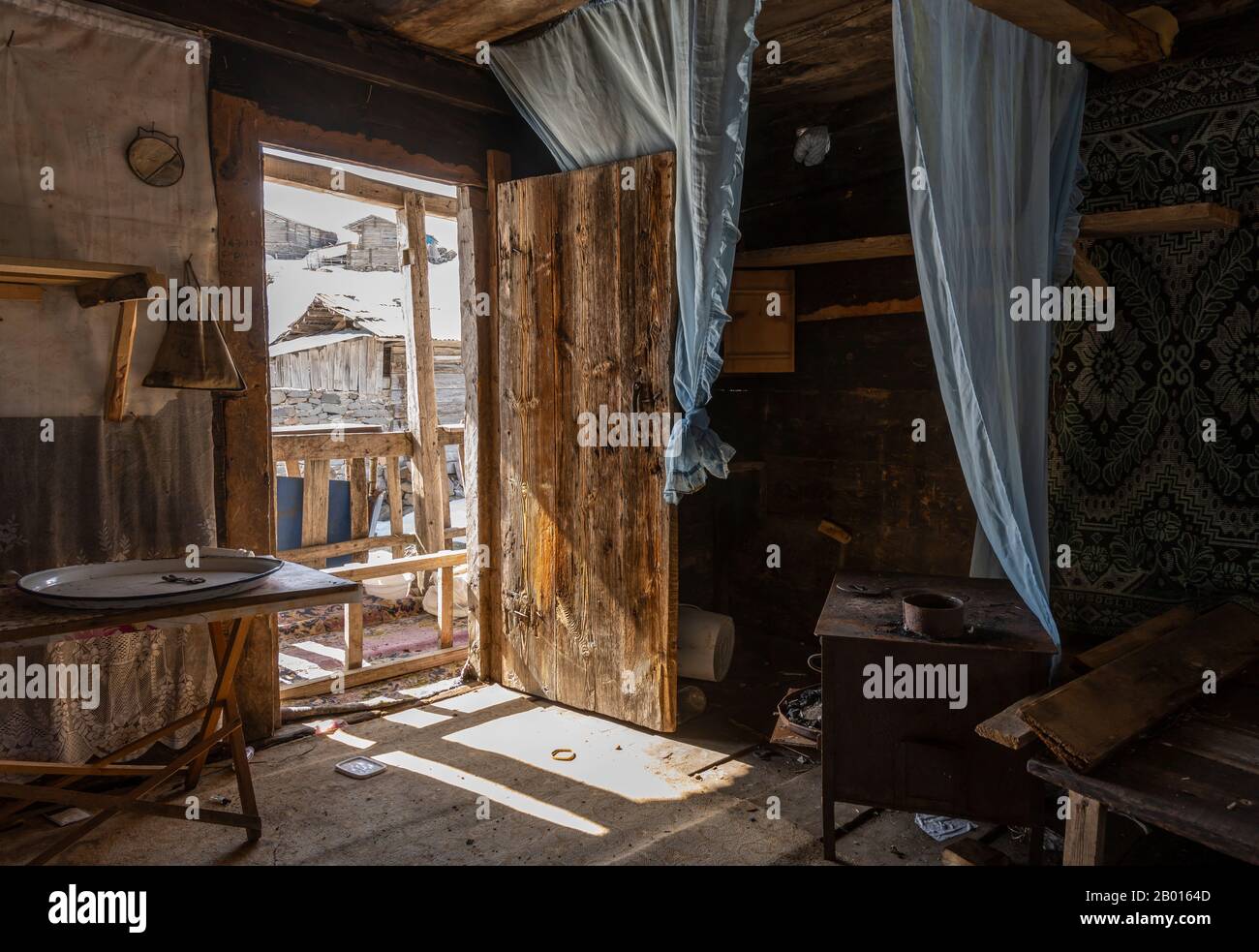 Koprulu, Turkey - May 9, 2019: Interior of a abandoned log cabin in the small village of Koprulu in the snow in Artvin, Turkey. Stock Photo