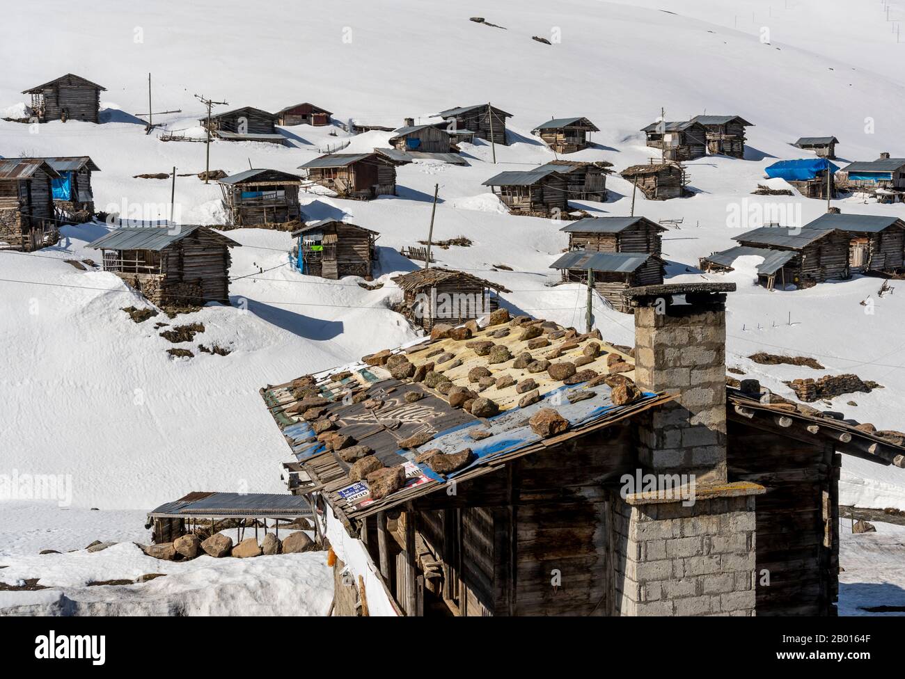 Koprulu, Turkey - May 9, 2019: Small village of Koprulu in the snow with wooden houses and cabins in a snowy valley in Turkey. Stock Photo