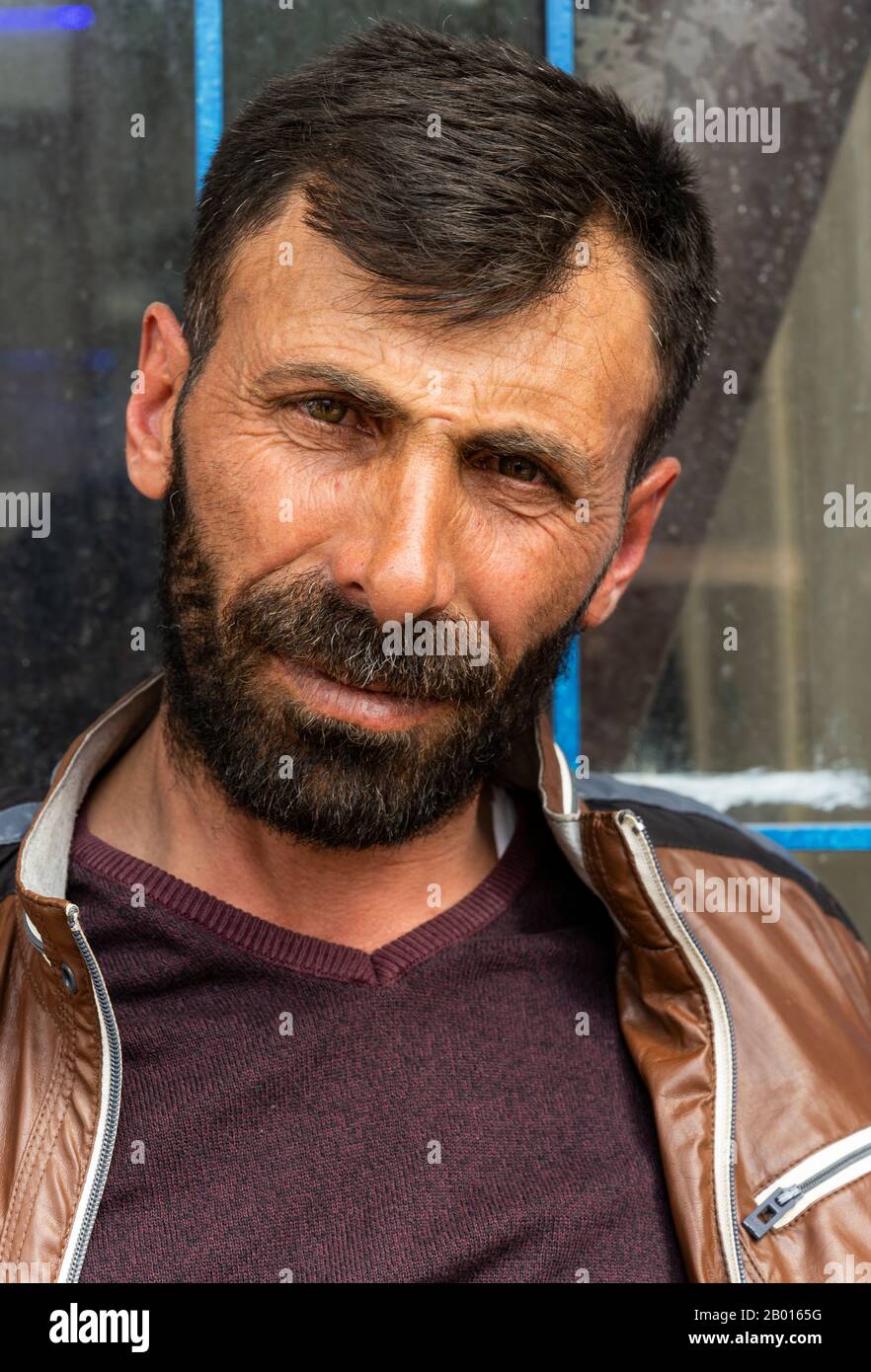 Susuz, Turkey - May 9, 2019: Turkish man with hat, moustache and beard in a turkish cafe. Stock Photo