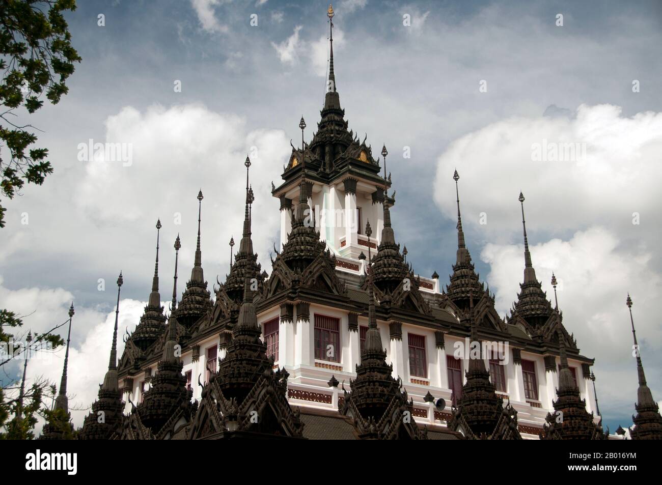 Thailand: Loha Prasad (Brazen Palace or Iron Monastery), Wat Ratchanatda, Bangkok.  Wat Ratchanaddaram was built on the orders of King Nangklao (Rama III) for Mom Chao Ying Sommanus Wattanavadi in 1846. The temple is best known for the Loha Prasada (Loha Prasat), a multi-tiered structure 36 m high and having 37 metal spires. It is only the third Loha Prasada (Brazen Palace or Iron Monastery) to be built and is modelled after the earlier ones in India and Anuradhapura, Sri Lanka. Stock Photo