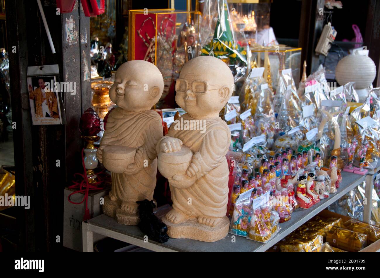 Thailand: Amulet and religious paraphernalia market at Wat Ratchanatda, Bangkok.  Wat Ratchanaddaram was built on the orders of King Nangklao (Rama III) for Mom Chao Ying Sommanus Wattanavadi in 1846. The temple is best known for the Loha Prasada (Loha Prasat), a multi-tiered structure 36 m high and having 37 metal spires. It is only the third Loha Prasada (Brazen Palace or Iron Monastery) to be built and is modelled after the earlier ones in India and Anuradhapura, Sri Lanka. Stock Photo