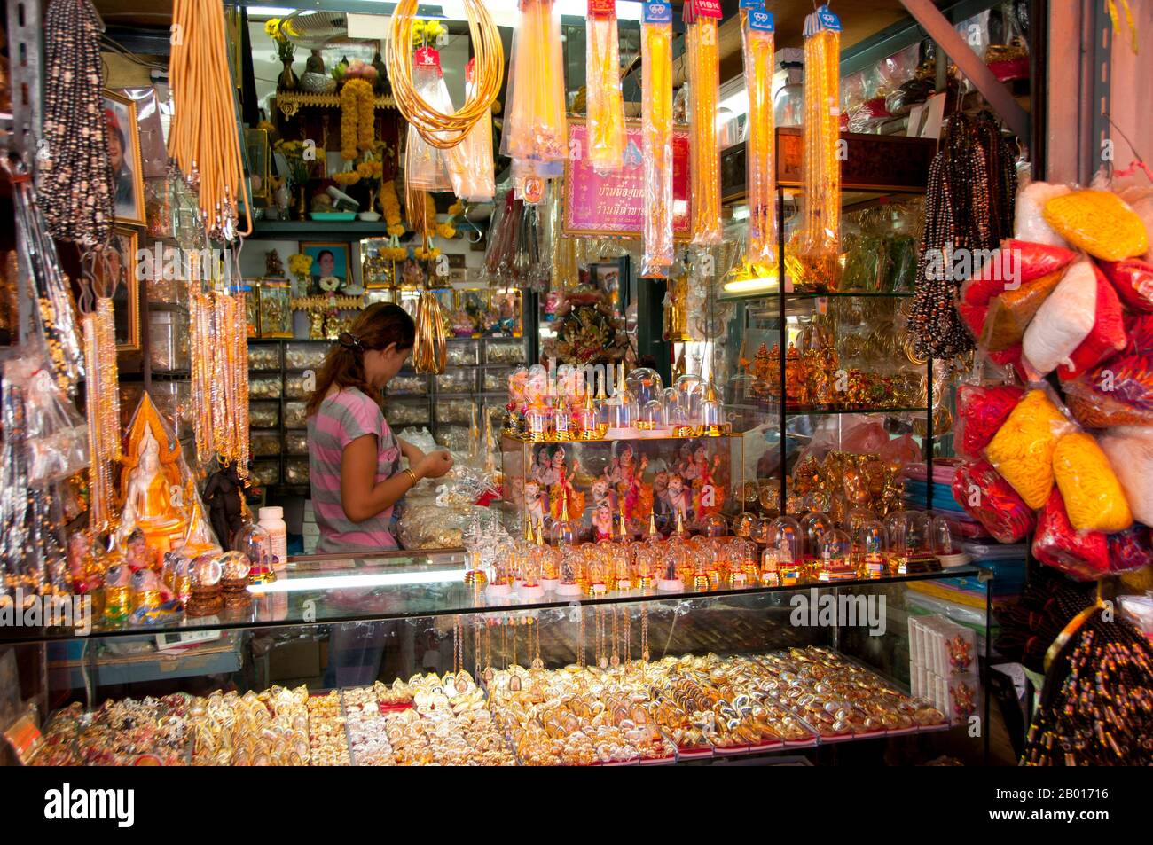 Thailand: Religious items shop, amulet and religious paraphernalia market at Wat Ratchanatda, Bangkok.  The religious paraphernalia market within the grounds of Wat Ratchanatda sells Buddha images and Buddhist charms in all shapes and sizes as well as a variety of Indian Hindu deities and Chinese religious items.  Wat Ratchanaddaram was built on the orders of King Nangklao (Rama III) for Mom Chao Ying Sommanus Wattanavadi in 1846. The temple is best known for the Loha Prasada (Loha Prasat), a multi-tiered structure 36 m high and having 37 metal spires. Stock Photo