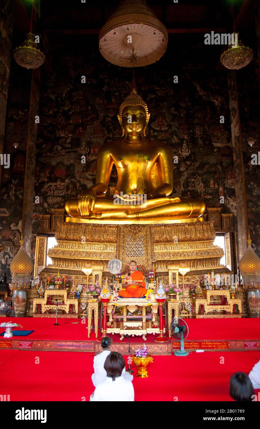 Thailand: The Phra Sri Sakyamuni Buddha image, Wat Suthat, Bangkok.  Wat Suthat Thepphawararam is a royal temple of the first grade, one of six such temples in Thailand. Construction was begun by King Buddha Yodfa Chulaloke (Rama I) in 1807. Further construction and decorations were carried out by King Buddha Loetla Nabhalai (Rama II) who helped carve the wooden doors, but the temple was not completed until the reign of King Jessadabodindra (Rama III) in 1847. The temple is a fine example of the Rattanakosin architectural style. Stock Photo