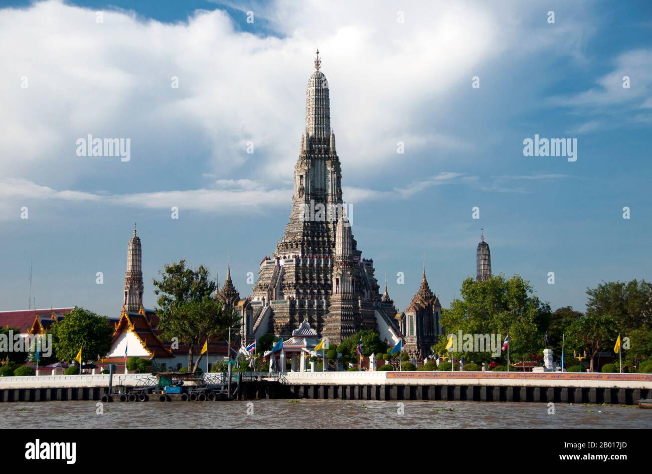 Thailand: Wat Arun (Temple of Dawn) from the Chao Phraya River, Bangkok.  Wat Arun Rajwararam (Temple of the Dawn), full name Wat Arunratchawararam Ratchaworamahawihan, is a Thai Buddhist temple on the Thonburi west bank side of the Chao Phraya River in Bangkok. It is named after Aruna, the Indian God of Dawn. A monastery has stood here since the Ayutthayan period (1351 - 1767), but the temple's outstanding feature, the Khmer-style central prang, was not begun until 1809, during the reign of King Buddha Loetla Nabhalai (Rama II). Stock Photo