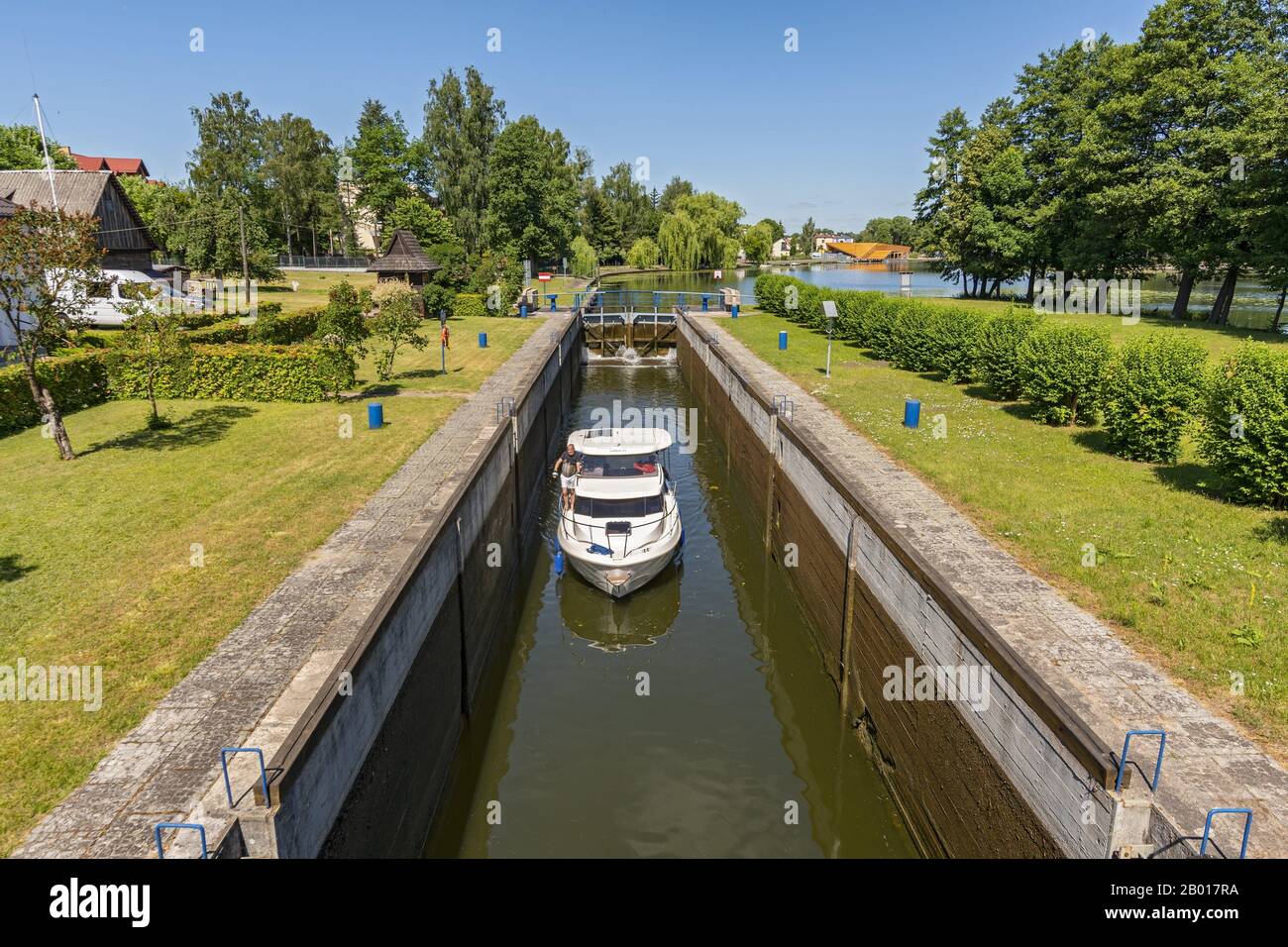 Boat entering gateway sluice (locks) on the Augustow Canal, Poland. Stock Photo