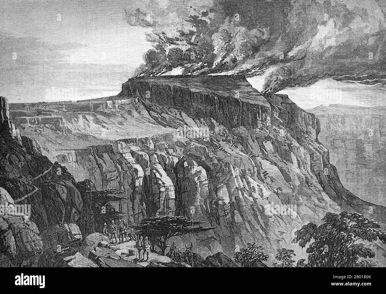 Ethiopia: 'The Destruction of Magdala'. Engraving from the 'Illustrated London News', c. 1868.  The British 1868 Expedition to Abyssinia was a punitive expedition carried out by armed forces of the British Empire against the Ethiopian Empire. Emperor Tewodros II of Ethiopia, also known as 'Theodore', imprisoned several missionaries and two representatives of the British government. The punitive expedition launched by the British in response required the transportation of a sizable military force hundreds of miles across mountainous terrain lacking any road system. Stock Photo