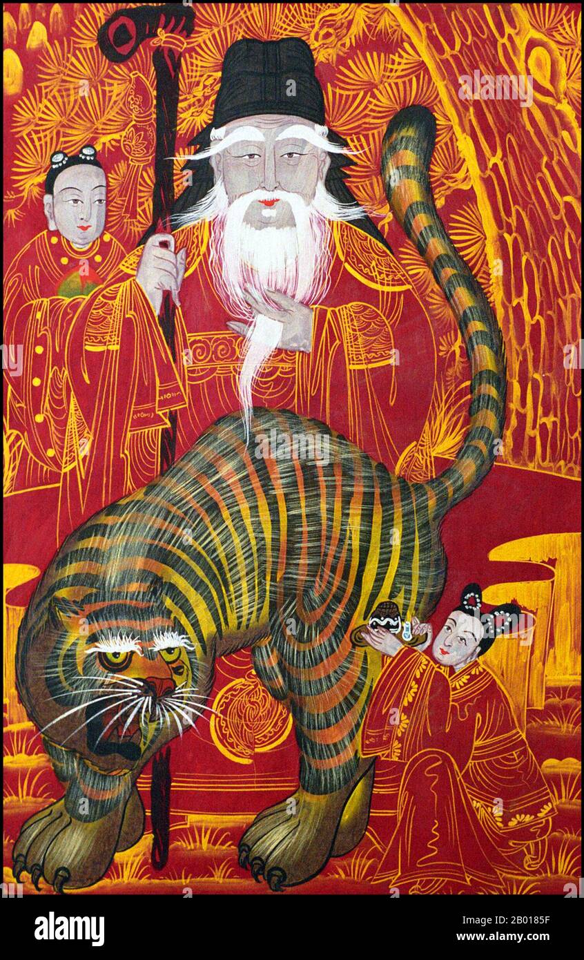 Korea: 'Mountain God'. Watercolour on paper and fabric painting, early 20th century.  In Korean folklore the tiger - pictured here accompanying or guarding the mountain god - is a benevolent creature that brings news from the gods to mankind. An acolyte stands beside the mountain god, while a supplicant makes an offering. Stock Photo