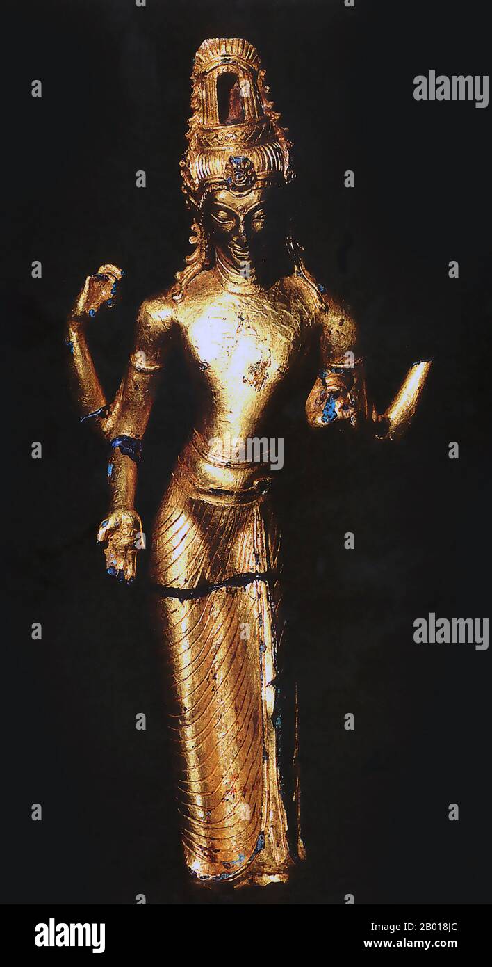 Indonesia: A golden statue of Avalokitesvara from Jambi, Sumatra. Srivijaya Period (8th-12th century CE). Photo by Gunkarta (CC BY-SA 3.0 License).  This four-armed, golden statue of Avalokitesvara, the Buddhist 'God/Goddess of Mercy', was discovered at Rataukapastuo in Jambi, east-central Sumatra. A stronghold of Vajrayana Buddhism in pre-Islamic Sumatra, Srivijaya attracted pilgrims and scholars from other parts of Asia. These included the Chinese monk Yijing, who made several lengthy visits to Sumatra on his way to study at Nalanda University in India in 671 and 695. Stock Photo