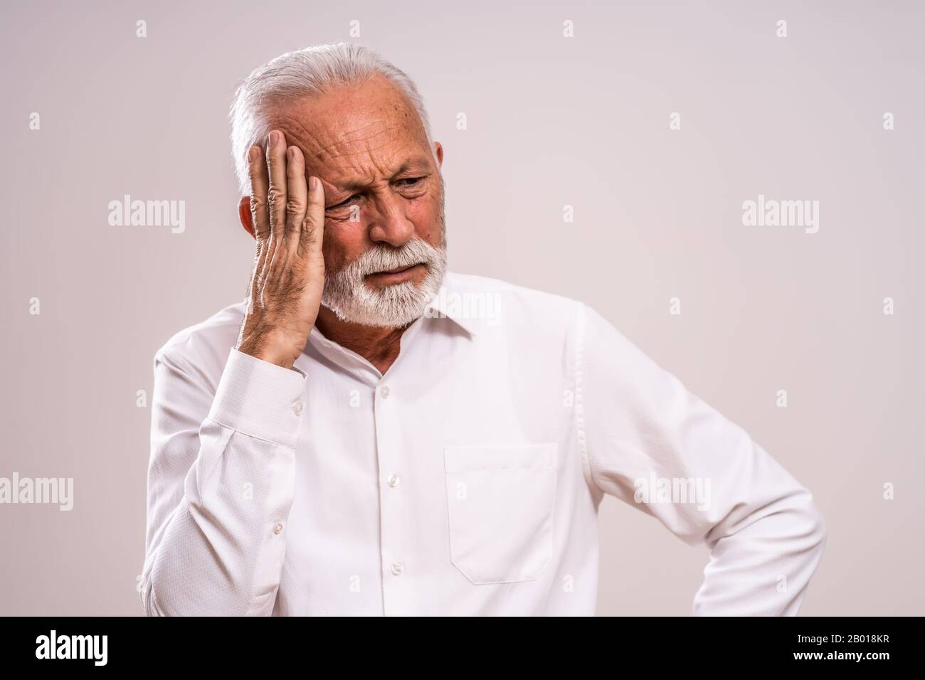 Portrait of depressed and preoccupied senior man. Stock Photo