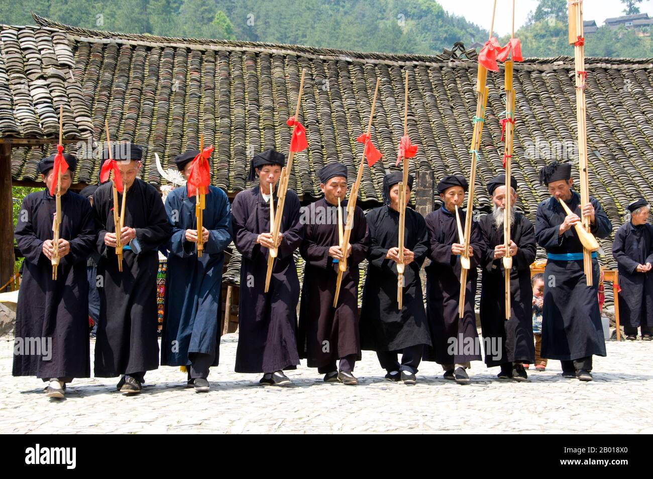 China: Miao men playing the lusheng, a traditonal Miao instrument, in ...