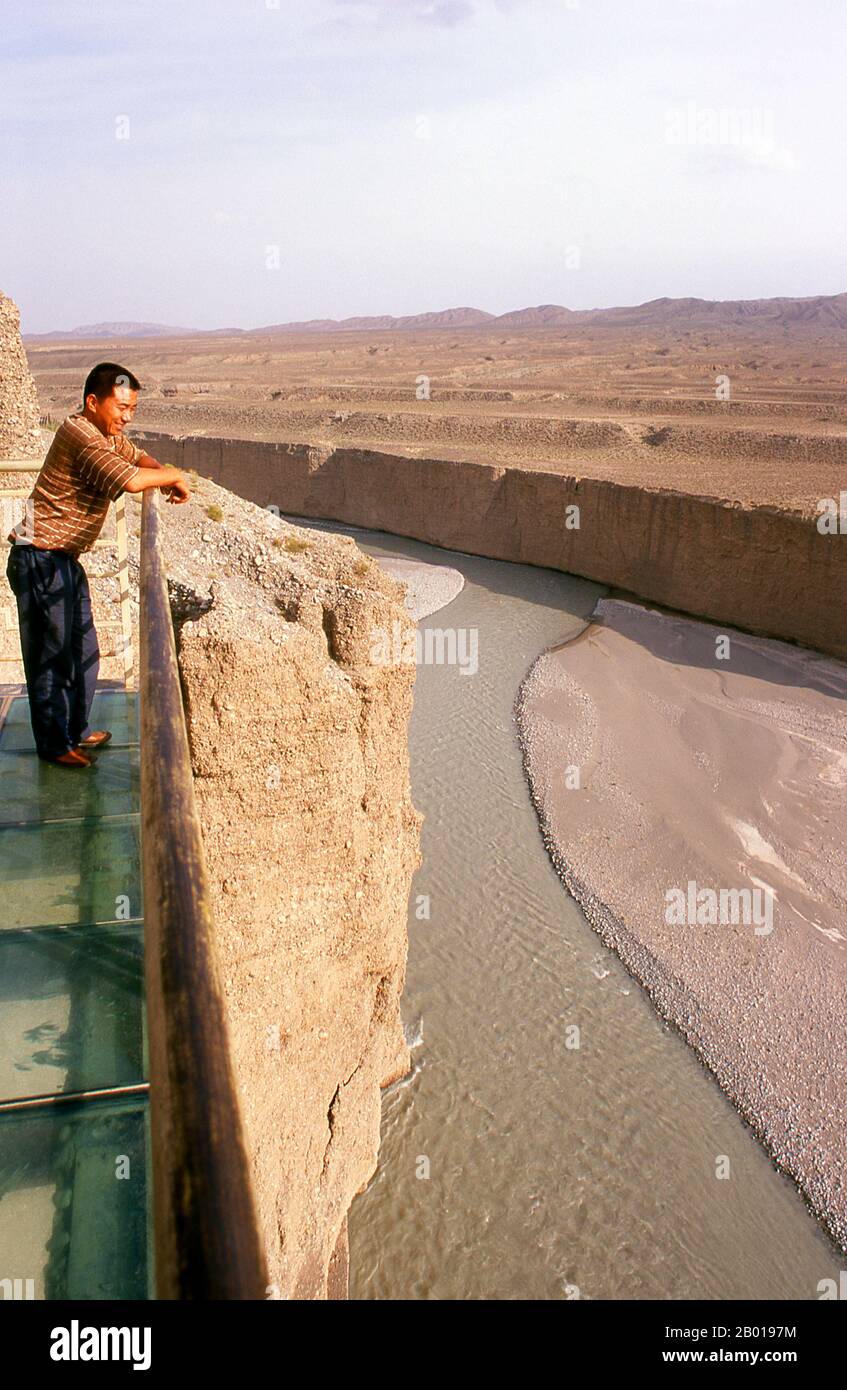 China: Glass balcony over the Taolai River Gorge marking the end of the Ming Great Wall near Jiayuguan Fort.  Jiayuguan, the ‘First and Greatest Pass under Heaven’, was completed in 1372 on the orders of Zhu Yuanzhang, the first Ming Emperor (1368-1398), to mark the end of the Ming Great Wall. It was also the very limits of Chinese civilisation, and the beginnings of the outer ‘barbarian’ lands.  For centuries the fort was not just of strategic importance to Han Chinese, but of cultural significance as well. This was the last civilised place before the outer darkness. Stock Photo