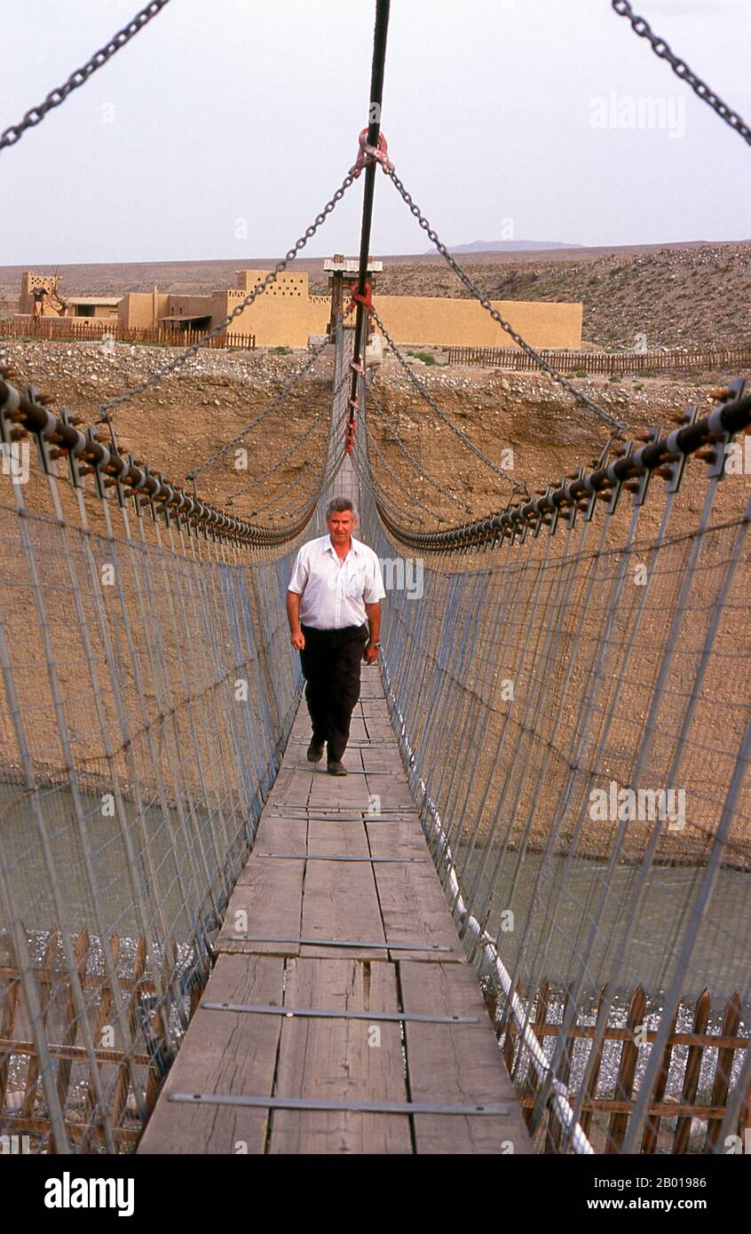 China: Bridge across the Taolai River Gorge marking the end of the Ming Great Wall near Jiayuguan Fort.  Jiayuguan, the ‘First and Greatest Pass under Heaven’, was completed in 1372 on the orders of Zhu Yuanzhang, the first Ming Emperor (1368-1398), to mark the end of the Ming Great Wall. It was also the very limits of Chinese civilisation, and the beginnings of the outer ‘barbarian’ lands.  For centuries the fort was not just of strategic importance to Han Chinese, but of cultural significance as well. This was the last civilised place before the outer darkness. Stock Photo