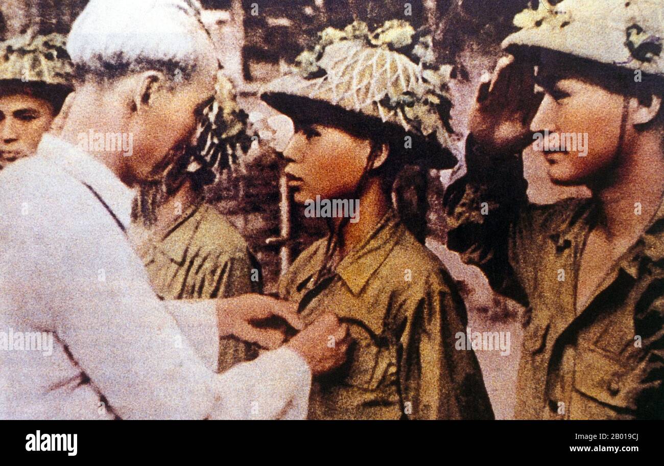 Vietnam: President Ho Chi Minh (19 May 1890 - 3 September 1969) giving medals for bravery after victory at Dien Bien Phu, 1954.  Hồ Chí Minh, born Nguyễn Sinh Cung and also known as Nguyễn Ái Quốc was a Vietnamese Communist revolutionary leader who was prime minister (1946-1955) and president (1945-1969) of the Democratic Republic of Vietnam (North Vietnam). He formed the Democratic Republic of Vietnam and led the Viet Cong during the Vietnam War until his death. Stock Photo