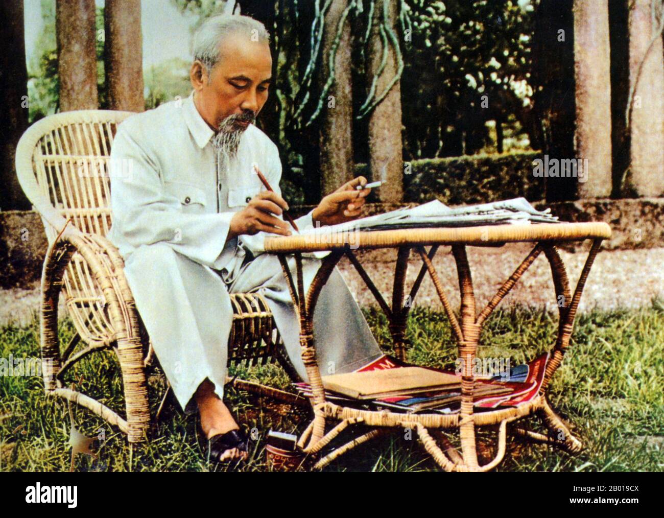 Vietnam: President Ho Chi Minh (19 May 1890 - 3 September 1969) working in the garden of the Presidential Palace, 1957.  Hồ Chí Minh, born Nguyễn Sinh Cung and also known as Nguyễn Ái Quốc was a Vietnamese Communist revolutionary leader who was prime minister (1946-1955) and president (1945-1969) of the Democratic Republic of Vietnam (North Vietnam). He formed the Democratic Republic of Vietnam and led the Viet Cong during the Vietnam War until his death. Stock Photo