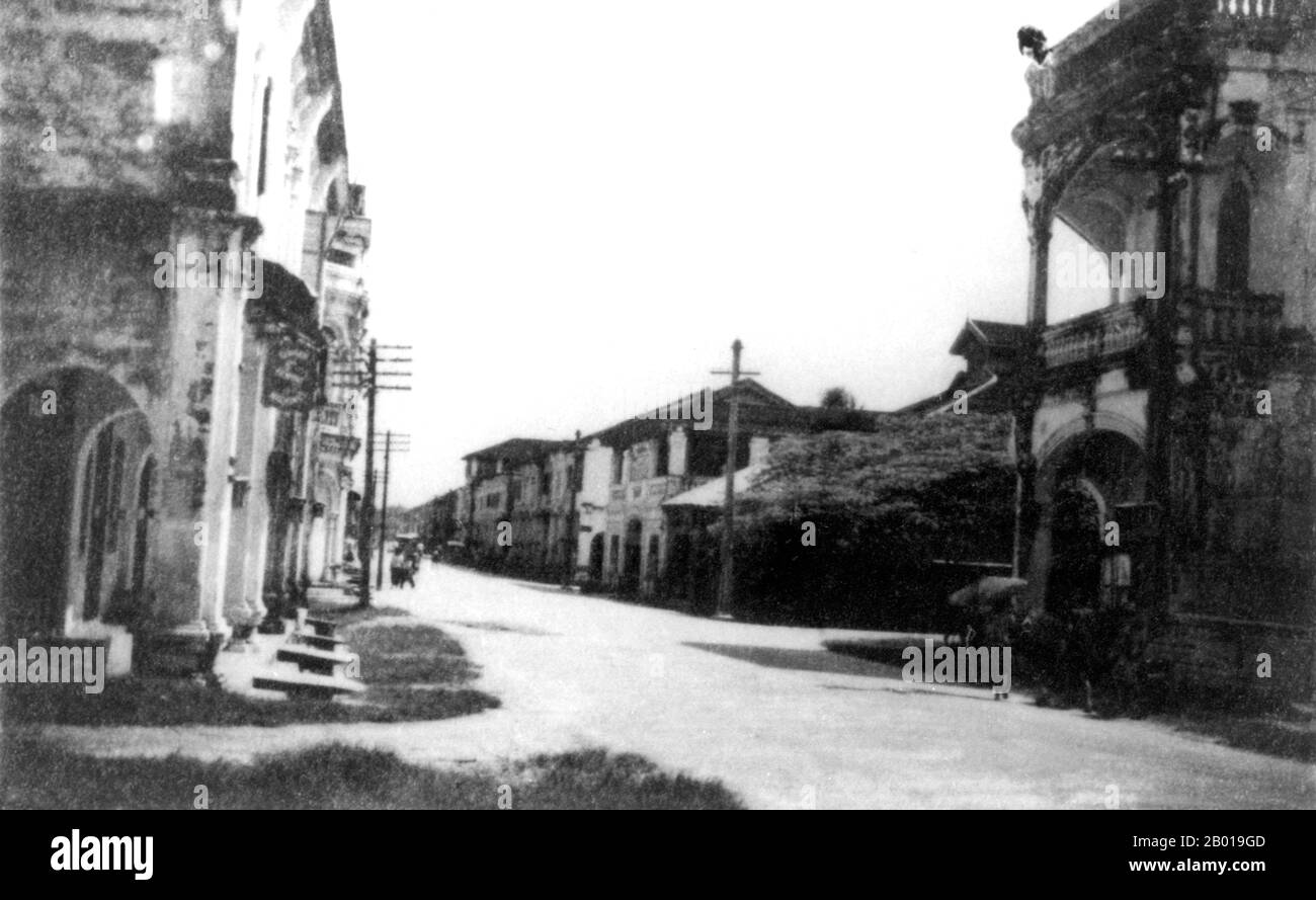 Thailand, A view of Yaowarat Road, Phuket, in 1941.  Phuket, formerly known as Talang and, in Western sources, Junk Ceylon (a corruption of the Malay Tanjung Salang, i.e. 'Cape Salang'), is one of the southern provinces (changwat) of Thailand. Neighbouring provinces are (from north clockwise) Phang Nga and Krabi, but as Phuket is an island there are no land boundaries.  Phuket, which is approximately the size of Singapore, is Thailand’s largest island. The island is connected to mainland Thailand by two bridges. It is situated off the west coast of Thailand in the Andaman Sea. Stock Photo
