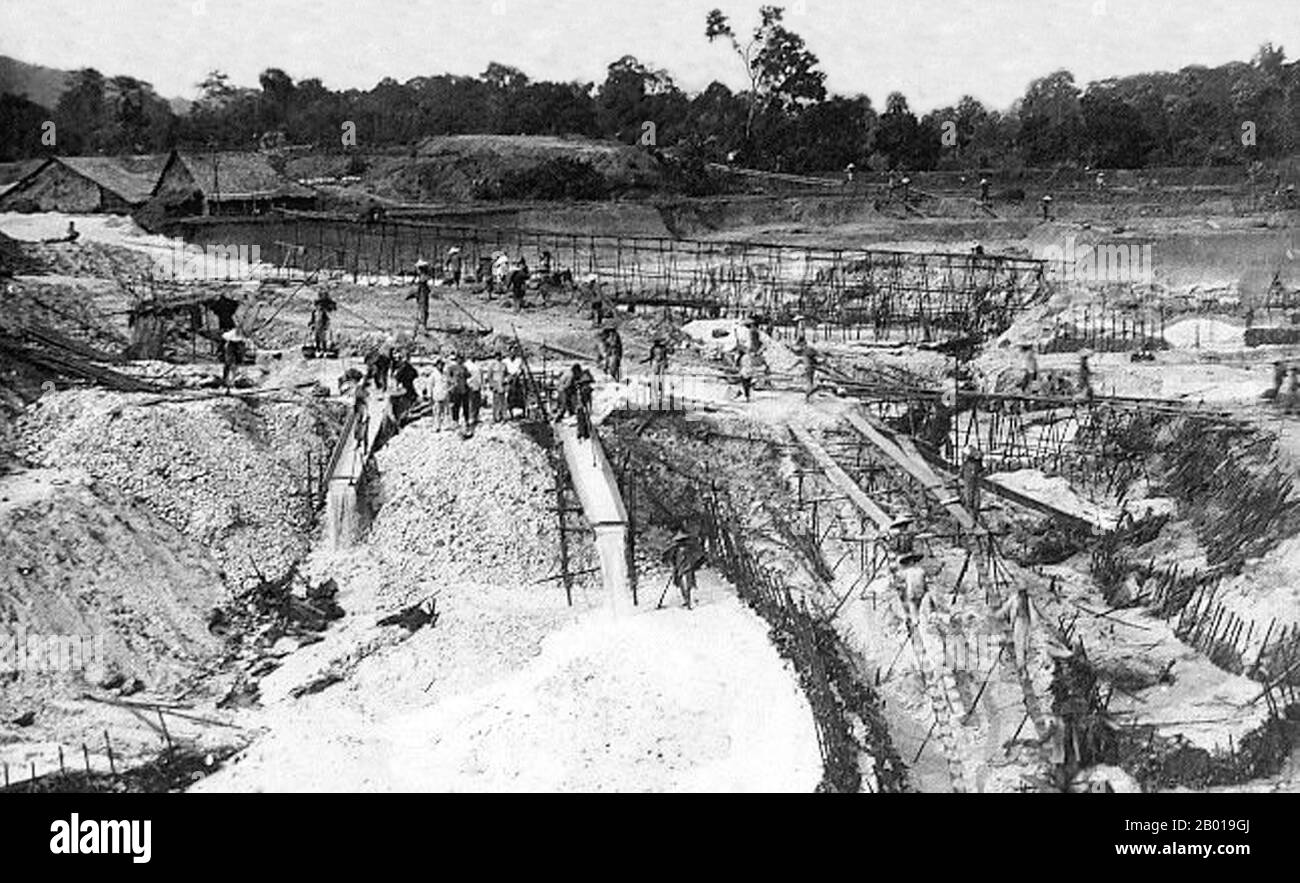 Thailand: Labourers working in an open cast tin mine, Phuket, c. 1925.  Phuket, formerly known as Talang and, in Western sources, Junk Ceylon (a corruption of the Malay Tanjung Salang, i.e. 'Cape Salang'), is one of the southern provinces (changwat) of Thailand. Neighbouring provinces are (from north clockwise) Phang Nga and Krabi, but as Phuket is an island there are no land boundaries.  Phuket, which is approximately the size of Singapore, is Thailand’s largest island. The island is connected to mainland Thailand by two bridges. It is situated off the west coast in the Andaman Sea. Stock Photo