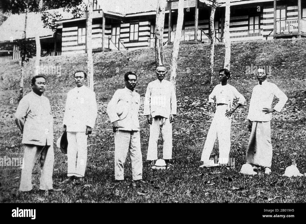 Thailand: A group of Thai government civil servants, Phuket. c. 1920.  Phuket, formerly known as Talang and, in Western sources, Junk Ceylon (a corruption of the Malay Tanjung Salang, i.e. 'Cape Salang'), is one of the southern provinces (changwat) of Thailand. Neighbouring provinces are (from north clockwise) Phang Nga and Krabi, but as Phuket is an island there are no land boundaries.  Phuket, which is approximately the size of Singapore, is Thailand’s largest island. The island is connected to mainland Thailand by two bridges. It is situated off the west coast of Thailand in the Andaman Sea Stock Photo