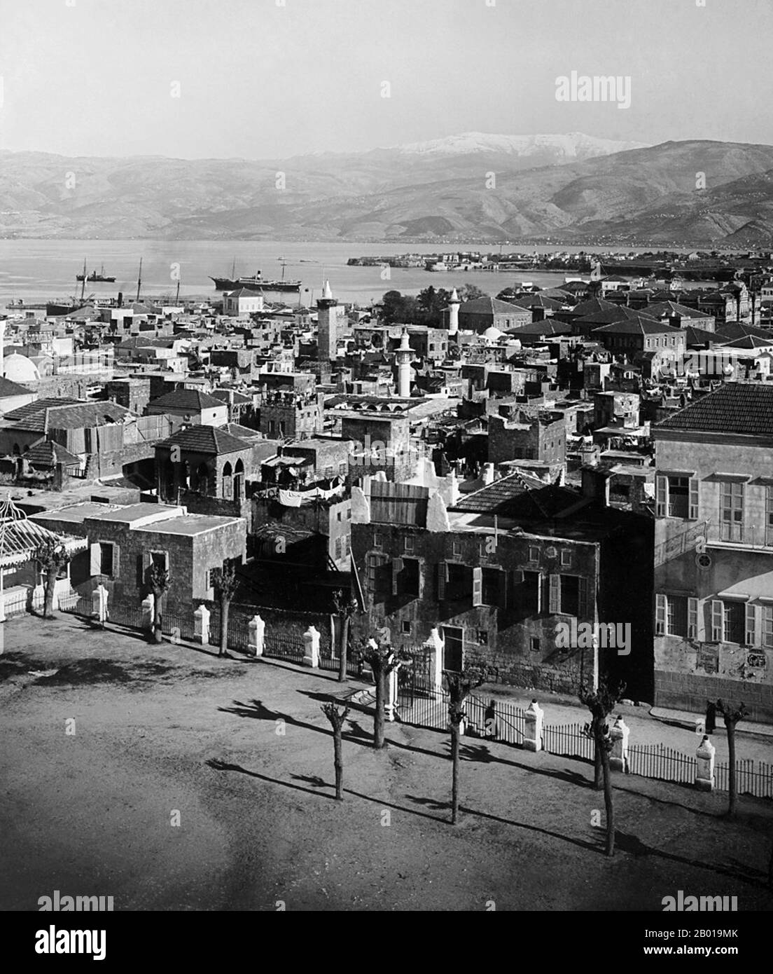 Lebanon: A view across Beirut to St George's Bay, c. 1898-1914.  Beirut (Arabic: Bayrūt) is the capital and largest city of Lebanon with a population ranging from some 1 million to more than 2 million as of 2007. Located on a peninsula at the midpoint of Lebanon's coastline with the Mediterranean, it serves as the country's largest and main seaport, and also forms the Beirut Metropolitan Area, which consists of the city and its suburbs. The first mention of this metropolis is found in the ancient Egyptian Tell el Amarna letters, dating to the 15th century BCE. Stock Photo