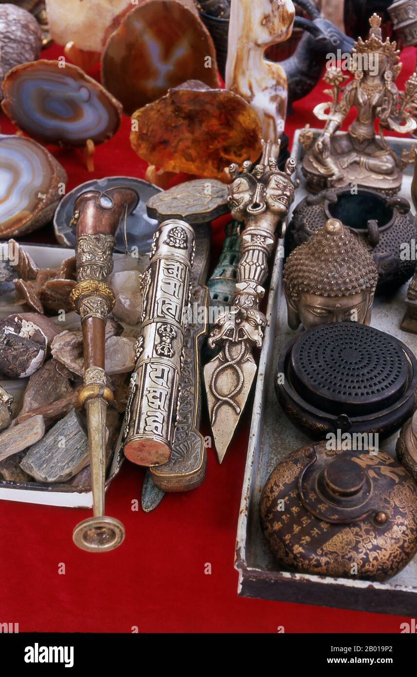 China: Handicrafts and souvenirs for sale within the Jiayuguan Fort, Gansu Province.  Jiayuguan, the ‘First and Greatest Pass under Heaven’, was completed in 1372 on the orders of Zhu Yuanzhang, the first Ming Emperor (1368-98), to mark the end of the Ming Great Wall. It was also the very limits of Chinese civilisation, and the beginnings of the outer ‘barbarian’ lands. For centuries the fort was not just of strategic importance to Han Chinese, but of cultural significance as well. This was the last civilised place before the outer darkness, those proceeding beyond facing a life of exile. Stock Photo