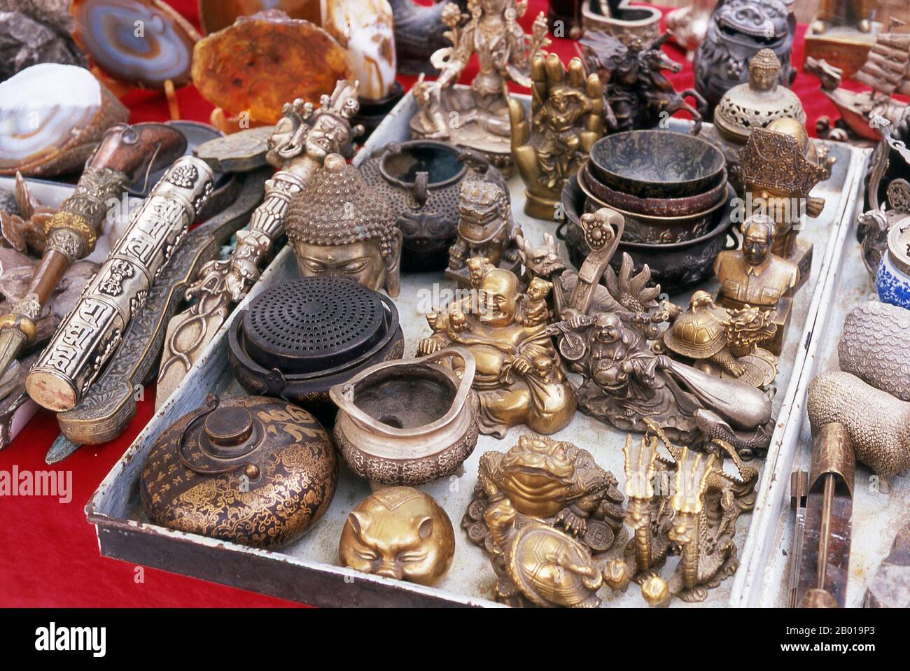 China: Handicrafts and souvenirs for sale within the Jiayuguan Fort, Gansu Province.  Jiayuguan, the ‘First and Greatest Pass under Heaven’, was completed in 1372 on the orders of Zhu Yuanzhang, the first Ming Emperor (1368-98), to mark the end of the Ming Great Wall. It was also the very limits of Chinese civilisation, and the beginnings of the outer ‘barbarian’ lands. For centuries the fort was not just of strategic importance to Han Chinese, but of cultural significance as well. This was the last civilised place before the outer darkness, those proceeding beyond facing a life of exile. Stock Photo