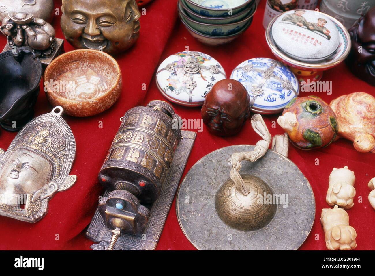 China: Handicrafts and souvenirs for sale within the Jiayuguan Fort, Gansu Province.  Jiayuguan, the ‘First and Greatest Pass under Heaven’, was completed in 1372 on the orders of Zhu Yuanzhang, the first Ming Emperor (1368-98), to mark the end of the Ming Great Wall. It was also the very limits of Chinese civilisation, and the beginnings of the outer ‘barbarian’ lands. For centuries the fort was not just of strategic importance to Han Chinese, but of cultural significance as well. This was the last civilised place before the outer darkness, those proceeding beyond facing a life of exile. Stock Photo