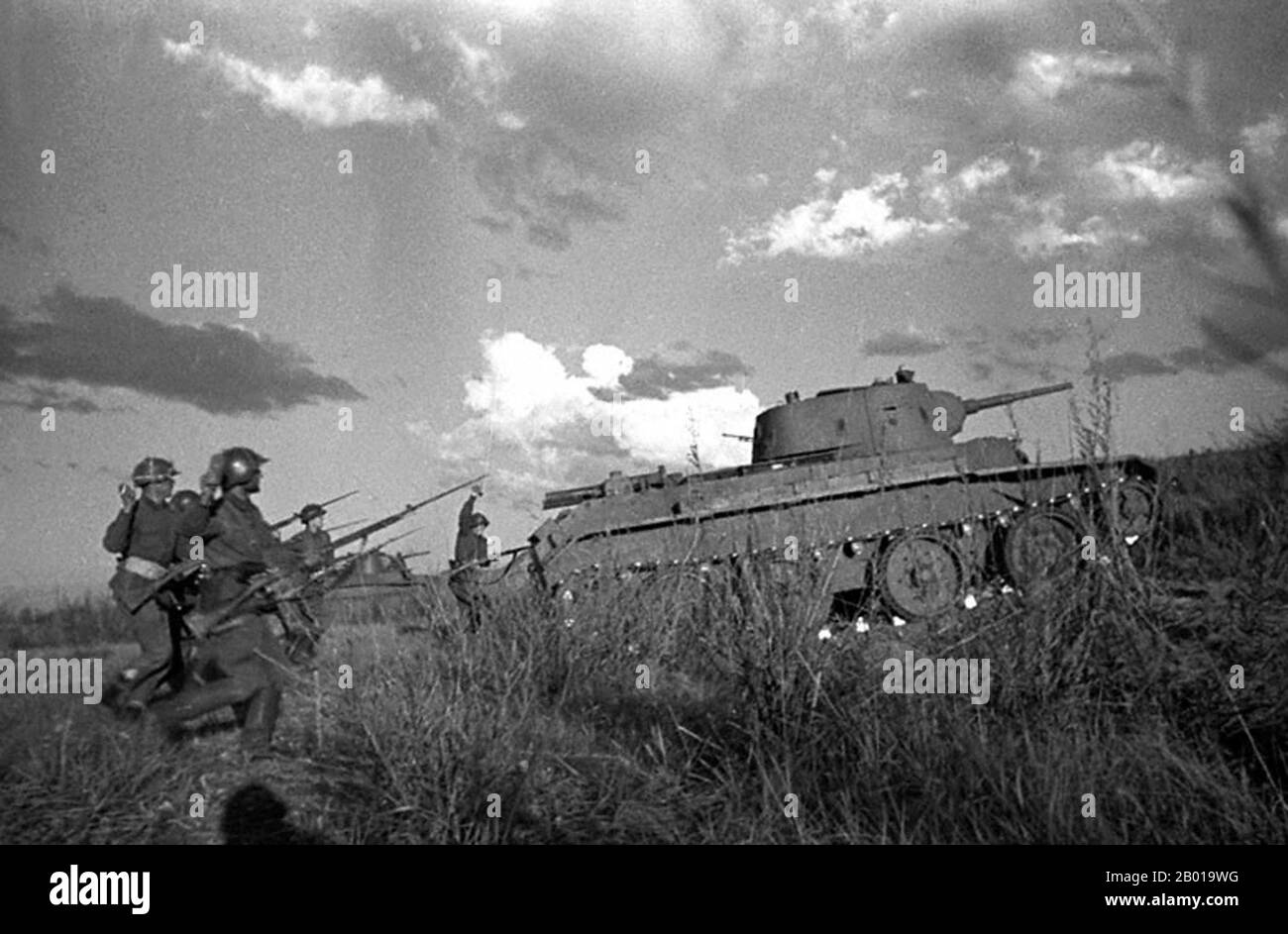 Mongolia: Soviet BT07 tanks and infantry attacking at Khalkhin Gol, 1939.  The Battles of Khalkhin Gol were the decisive engagements of the undeclared Soviet-Japanese Border War fought between the Soviet Union, Mongolia and Japan in 1939. They were named after the river Khalkhin Gol, which passes through the battlefield. In Japan, the decisive battle of the conflict is known as the Nomonhan Incident (Nomonhan Jiken) after a nearby village, and was a total defeat for their army. Stock Photo