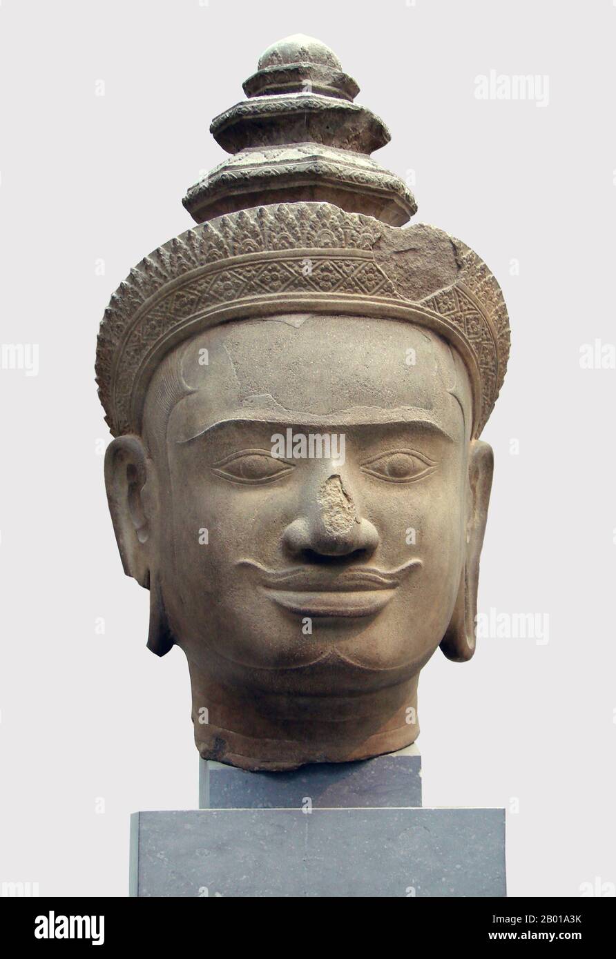Cambodia: Head of Vishnu from Phnom Bok, Siem Reap, now in the Musée Guimet, Paris, 9th-10th century.  Phnom Bok is a hill in the northeast of the East Baray in Cambodia, with a prasat (temple) of the same name built on it. It is one of a 'trilogy of mountains', each of which has a temple with similar layout. The creation of the temple is credited to the reign of Yasovarman I (889–910) between the 9th and 10th centuries and was established after he moved his capital to Angkor and named it Yasodharapura. The two other sister temples are Phnom Bakheng and Phnom Krom. Stock Photo
