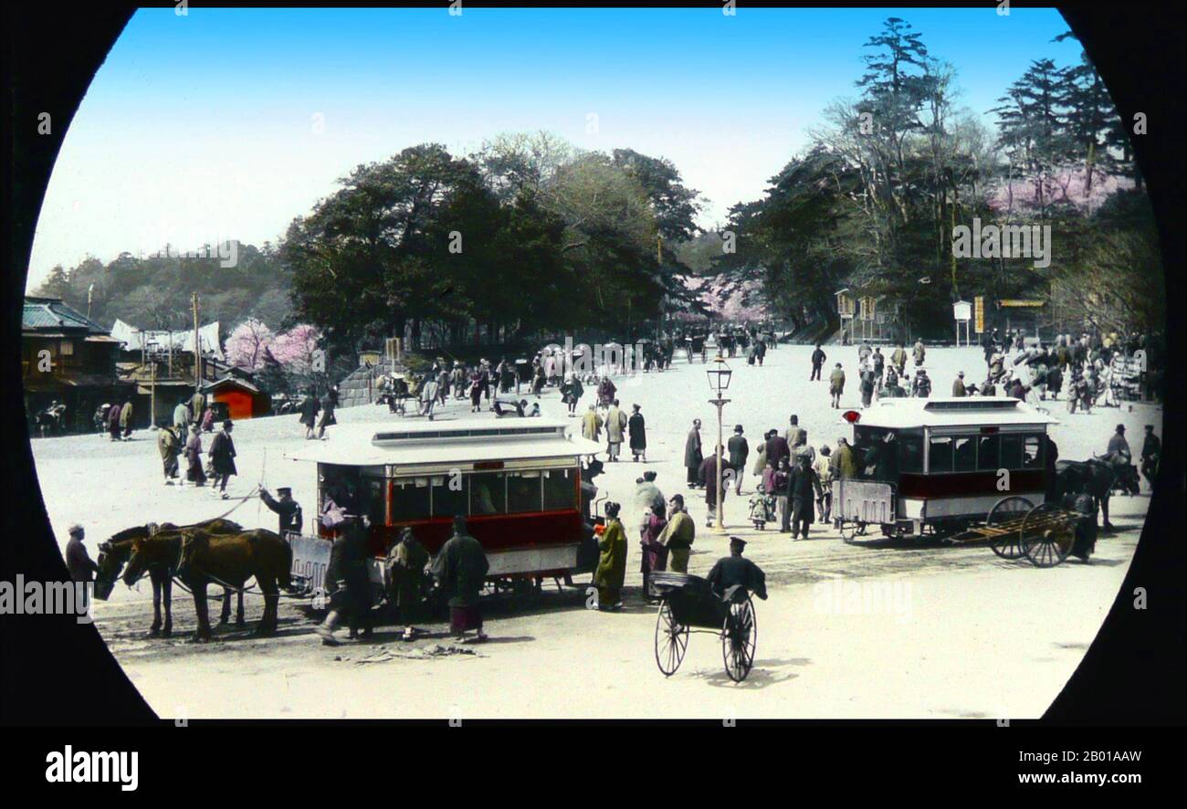 Japan: Horse-drawn buses in old Tokyo. Photo by T. Enami (1859-1929), c. 1895.  T. Enami (Enami Nobukuni) was the trade name of a celebrated Meiji period photographer. The T. of his trade name is thought to have stood for Toshi, though he never spelled it out on any personal or business document.  Born in Edo (now Tokyo) during the Bakumatsu era, Enami was first a student of, and then an assistant to the well known photographer and collotypist, Ogawa Kazumasa. Enami relocated to Yokohama, and opened a studio on Benten-dōri (Benten Street) in 1892. Stock Photo