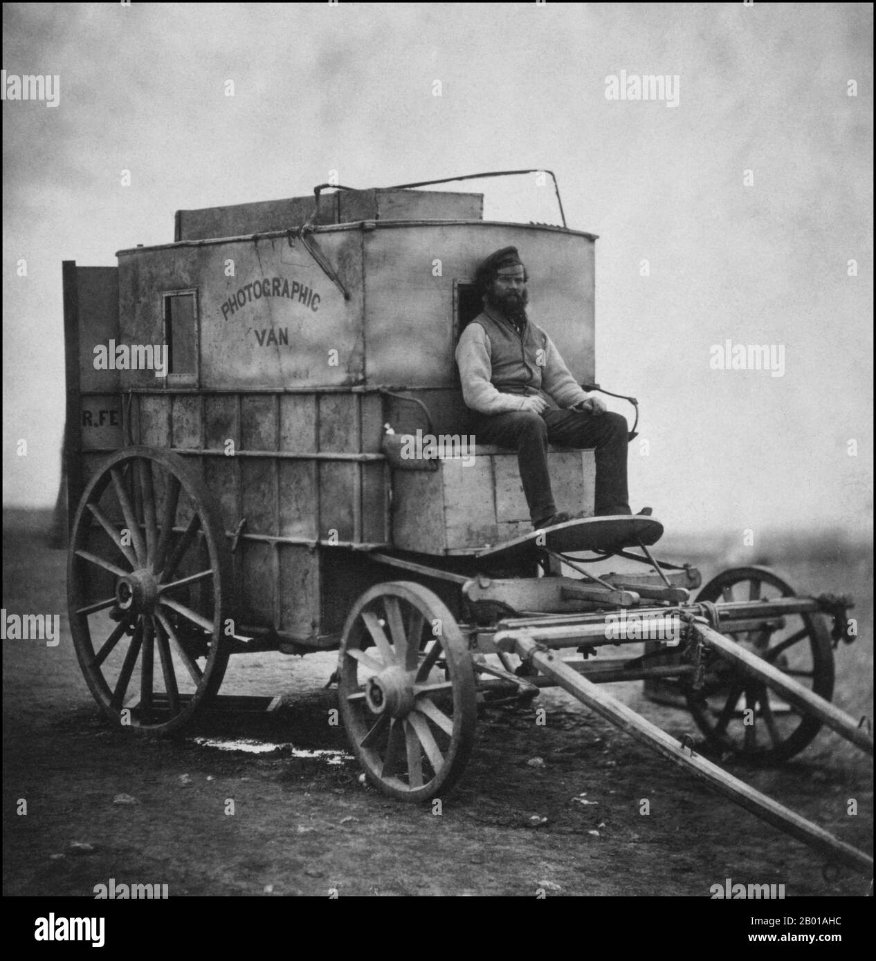 Great Britain/Russia: Roger Fenton's assistant Marcus Sparling seated on the horse-drawn 'Photographic Van' employed by Fenton during the Crimean War (1853-1856), 1855.  Roger Fenton (28 March 1819 – 8 August 1869) was a pioneering British photographer, one of the first war photographers. The Crimean War was one of the first wars to be documented extensively in written reports and photographs, notably by Roger Fenton and William Russell (for the Times). News correspondence reaching Britain from the Crimea was the first time the public were kept informed of the day-to-day realities of war. Stock Photo