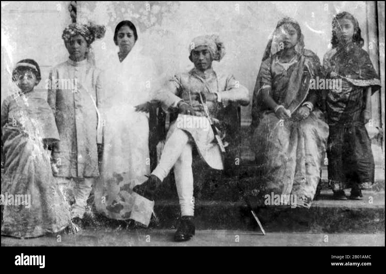Bangladesh: Raja Tridiv Roy (1933-2012), hereditary king of the Chakma people, seated with other members of the royal family c. 1947.  The Chakmas, also known as the Changhma, are a community that inhabits the Chittagong Hill Tracts of Bangladesh and North-East India. The Chakmas are the largest ethnic group in the Chittagong Hill Tracts, making up more than half the tribal population. Chakmas are divided into 46 clans or Gozas. A tribal group called Tongchangya are also considered to be a branch of the Chakma people. Both tribes speak the same language, have the same customs and culture. Stock Photo