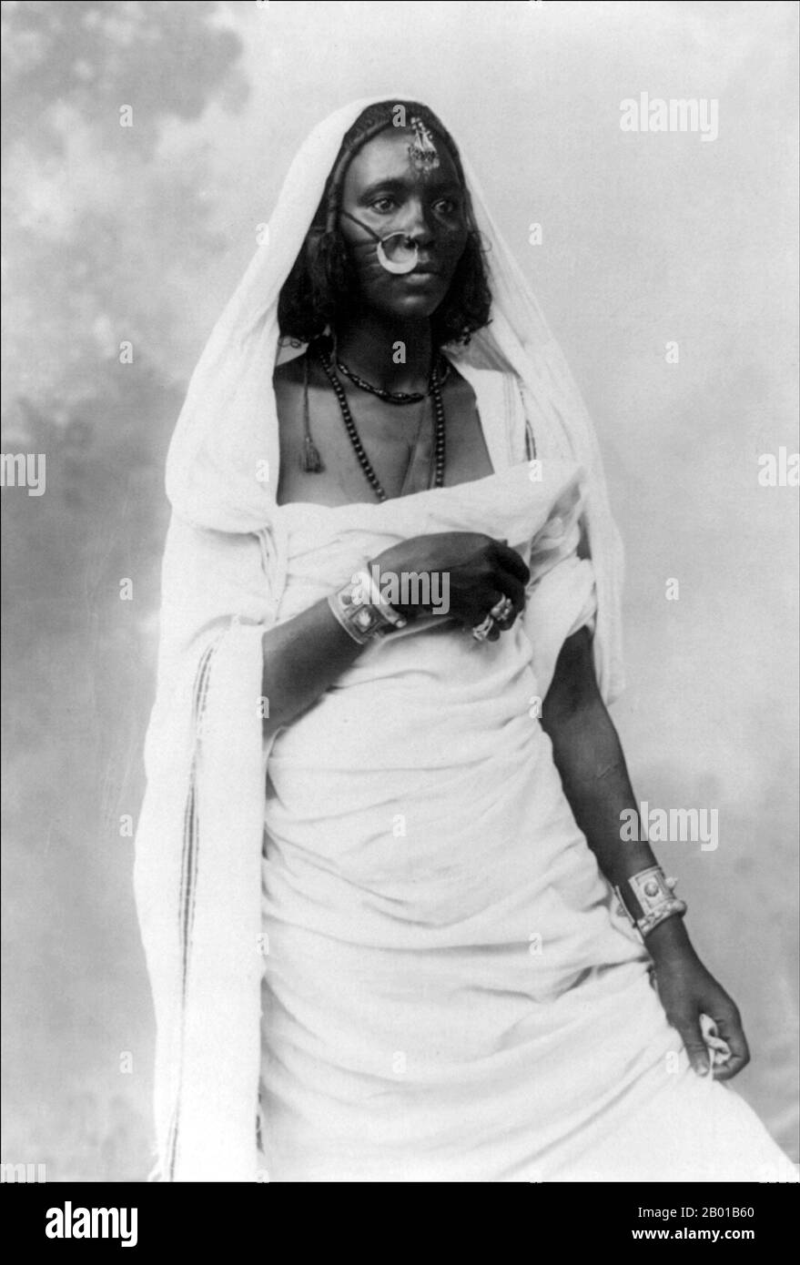 Sudan: Nubian woman. Photo by Jean Pascal Sebah (1872 - 6 June 1947), c. 1890-1923.  Nubia is a region along the Nile, in northern Sudan and southern Egypt.  There were a number of small Nubian kingdoms throughout the Middle Ages, the last of which collapsed in 1504, when Nubia became divided between Egypt and the Sennar sultanate resulting in the Arabization of much of the Nubian population. Nubia was again united within Ottoman Egypt in the 19th century, and within Anglo-Egyptian Sudan from 1899 to 1956.  The name Nubia is derived from that of the Noba people. Stock Photo