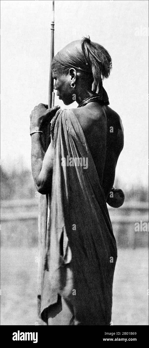 Sudan/South Sudan: A Shilluk or Chollo warrior. Photo by Hugo Adolf Bernatzik (26 March 1897 - 9 March 1953), 1930.  The Shilluk, who prefer to be known as Chollo, are a major Nilotic ethnic group of southern Sudan, living on both banks of the river Nile, in the vicinity of the city of Malakal. The most extensive Chollo area is located on the western bank of the Nile north from Malakal. Before the second Sudanese civil war the Chollo also lived in a number of settlements on the northern bank of the Sobat river.  The Shilluk are the third largest minority ethnic group of southern Sudan. Stock Photo
