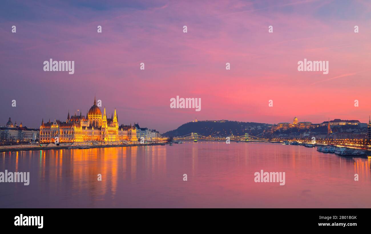 Budapest, Hungary. Panoramic cityscape image of Budapest, capital city of Hungary with Hungarian Parliament Building during beautiful sunset. Stock Photo