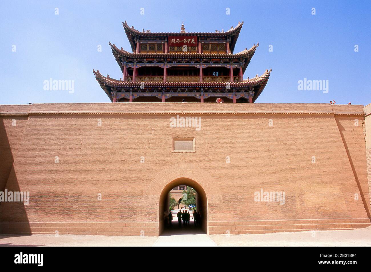 China: Guanghua Men (Gate of Enlightenment), Jiayuguan Fort, Jiayuguan, Gansu.  Jiayuguan, the ‘First and Greatest Pass under Heaven’, was completed in 1372 on the orders of Zhu Yuanzhang, the first Ming Emperor (1368-98), to mark the end of the Ming Great Wall. It was also the very limits of Chinese civilisation, and the beginnings of the outer ‘barbarian’ lands.  For centuries the fort was not just of strategic importance to Han Chinese, but of cultural significance as well. This was the last civilised place before the outer darkness, and those proceeding beyond faced a life of exile. Stock Photo