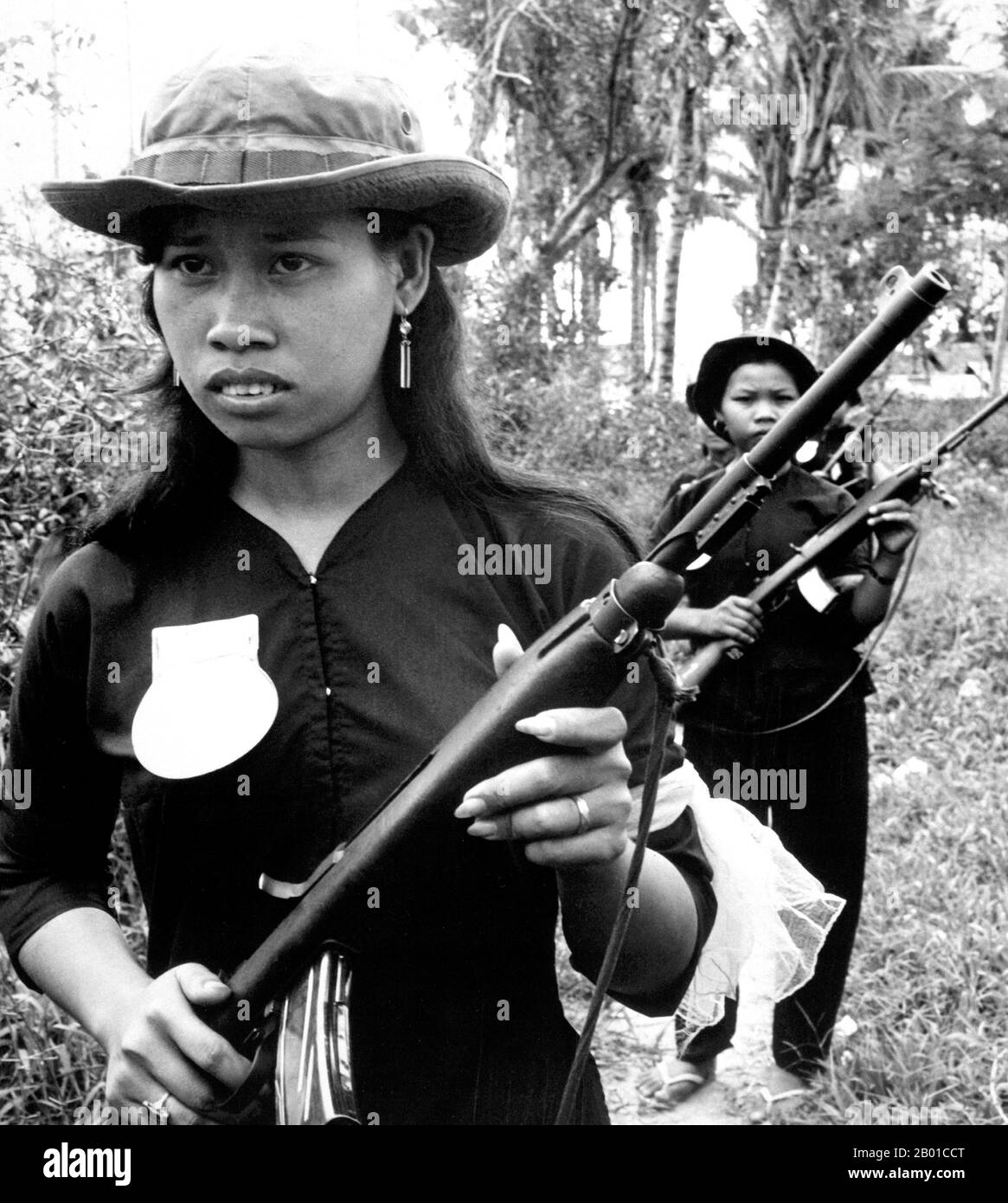 Vietnam: Female volunteers of the (South Vietnamese) People's Self-Defense Force of Kien Dien, Ben Cat District, 50 km north of Saigon, c. 1961-1972.  The Second Indochina War, known in America as the Vietnam War, was a Cold War era military conflict that occurred in Vietnam, Laos, and Cambodia from 1 November 1955 to the fall of Saigon on 30 April 1975. This war followed the First Indochina War and was fought between North Vietnam, supported by its communist allies, and the government of South Vietnam, supported by the U.S. and other anti-communist nations. Stock Photo
