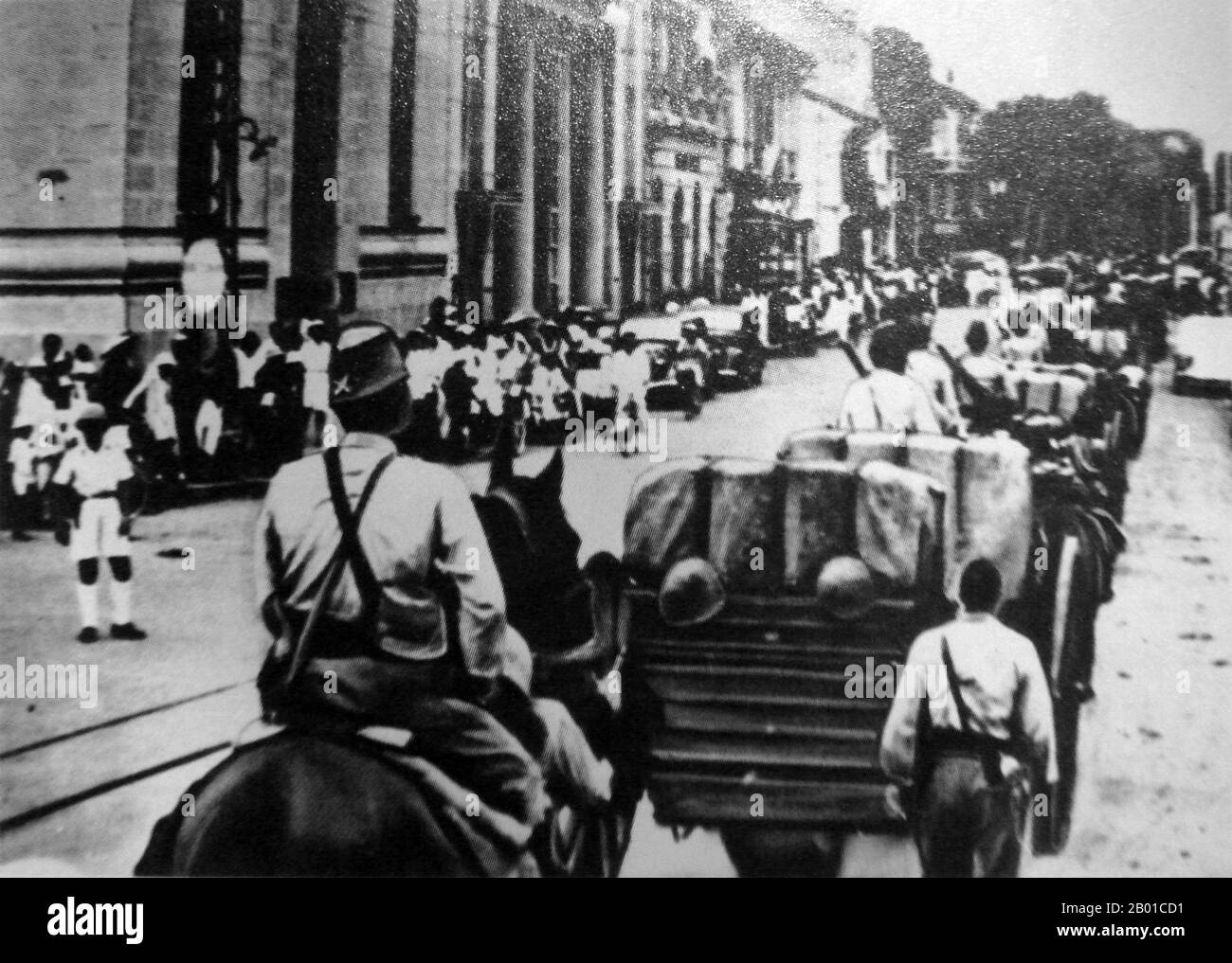 Vietnam: Japanese troops entering Saigon, French Indochina, 1941.  In September 1940, during World War II, the newly created regime of Vichy France granted Japan's demands for military access to Tonkin with the invasion of French Indochina (or Vietnam Expedition). This allowed Japan better access to China in the Second Sino-Japanese War against the forces of Chiang Kai-shek, but it was also part of Japan's strategy for dominion over the Greater East Asia Co-Prosperity Sphere. Stock Photo