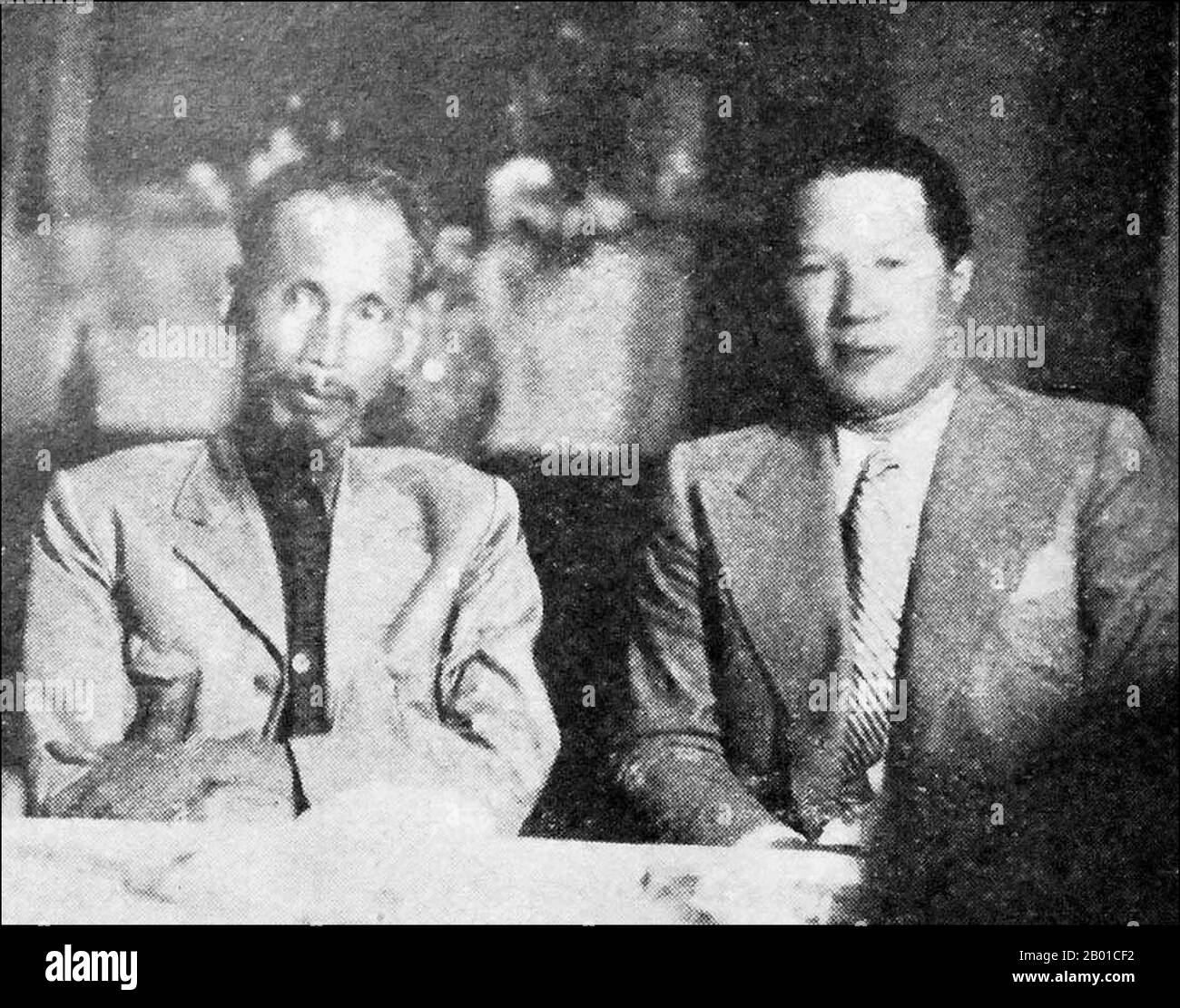 Vietnam: Former Emperor Bao Dai (22 October 1913 - 31 July 1997), shortly after abdicating in 1945 in favour of the Viet Minh, sitting with Ho Chi Minh as a 'simple citizen' and the supreme advisor of the Democratic Republic Of Vietnam. Photo by T. Do Khac, 1 June 1946.  Japan surrendered to the Allies in August 1945, and the Vietminh under the leadership of Hồ Chí Minh attempted to take power in a free Vietnam. Hồ was able to persuade Bao Dai to abdicate on 25 August 1945, handing power over to the Vietminh - an event which greatly enhanced Hồ's legitimacy in the eyes of the Vietnamese people Stock Photo