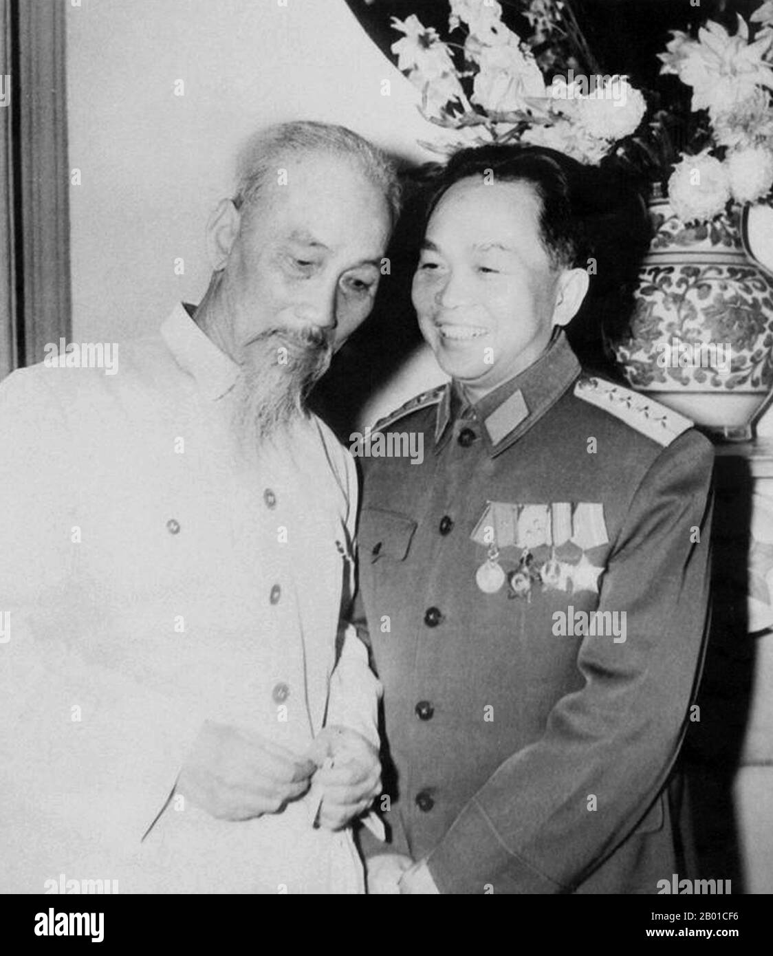 Vietnam: President Ho Chi Minh (19 May 1890 – 3 September 1969) talking with General Vo Nguyen Giap (25 August 1911 - 4 October 2013), Hanoi, 1962.  Hồ Chí Minh, born Nguyễn Sinh Cung and also known as Nguyễn Ái Quốc, was a Vietnamese Communist revolutionary leader who was prime minister (1946-1955) and president (1945-1969) of the Democratic Republic of Vietnam (North Vietnam).  Vo Nguyen Giap (Vietnamese: Võ Nguyên Giáp) was a Vietnamese officer in the Vietnam People's Army and a politician. He was a principal commander in the two Indochina Wars. Stock Photo