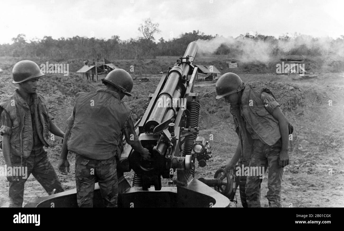 Vietnam: Army of the Republic of Vietnam (ARVN) troops firing an M102 howitzer, 1968.  The Second Indochina War, known in America as the Vietnam War, was a Cold War era military conflict that occurred in Vietnam, Laos, and Cambodia from 1 November 1955 to the fall of Saigon on 30 April 1975. This war followed the First Indochina War and was fought between North Vietnam, supported by its communist allies, and the government of South Vietnam, supported by the U.S. and other anti-communist nations. The U.S. government viewed involvement in the war as a way to prevent a communist takeover. Stock Photo