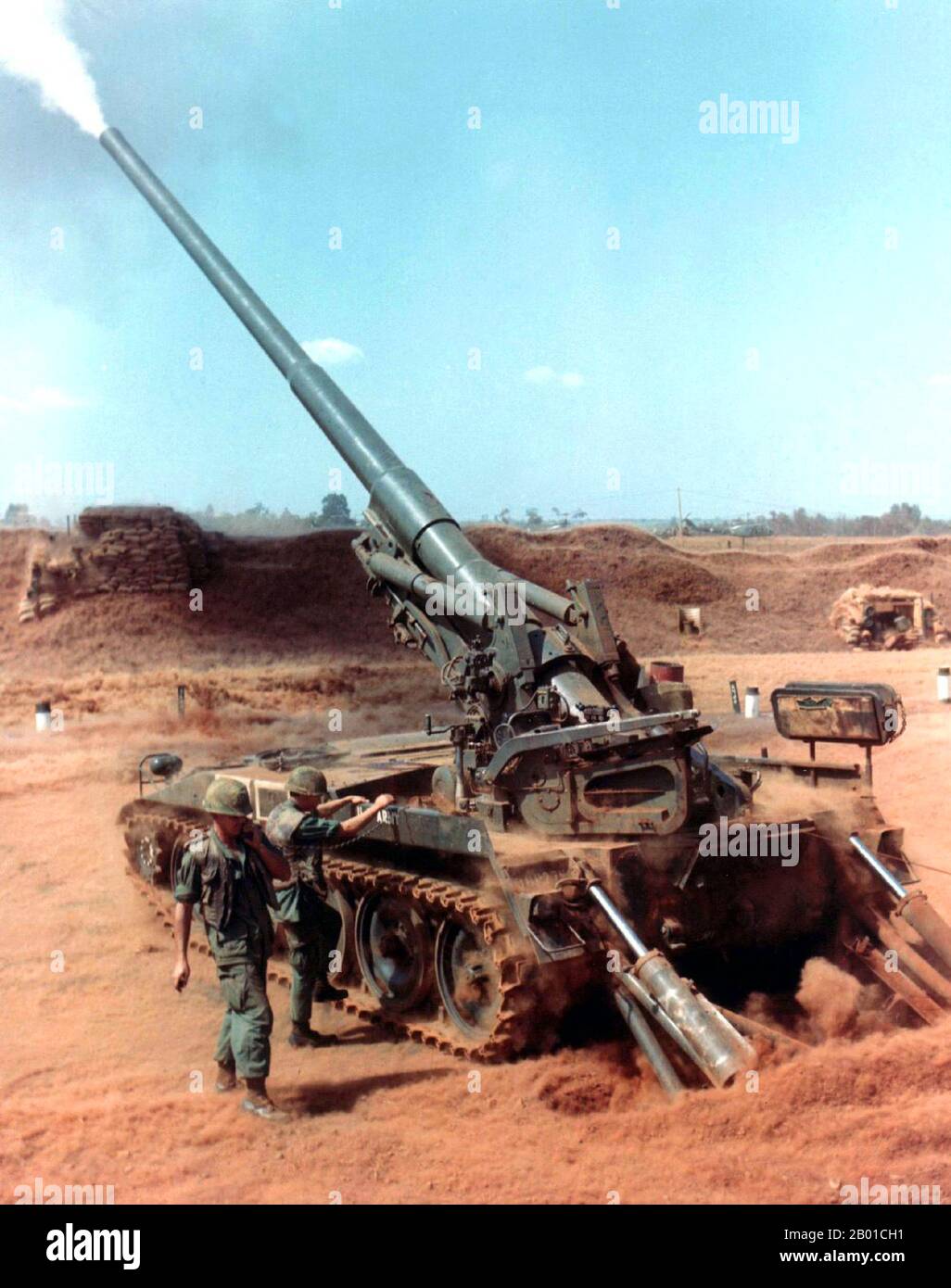 Vietnam: US Army gunners firing an M-107 175mm self-propelled gun during a 'Search and Destroy' operation (Operation San Angelo) in Quang Duc Province, January 1968.  The Second Indochina War, known in America as the Vietnam War, was a Cold War era military conflict that occurred in Vietnam, Laos, and Cambodia from 1 November 1955 to the fall of Saigon on 30 April 1975. This war followed the First Indochina War and was fought between North Vietnam, supported by its communist allies, and the government of South Vietnam, supported by the U.S. and other anti-communist nations. Stock Photo
