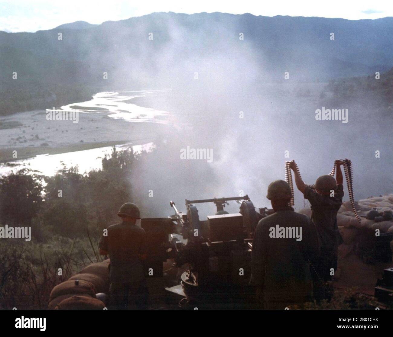 Vietnam: Troops from the US 7th Cavalry Regiment firing a quad 50 machine gun during Operation Pershing in Binh Dinh Province, 1967.  The Second Indochina War, known in America as the Vietnam War, was a Cold War era military conflict that occurred in Vietnam, Laos, and Cambodia from 1 November 1955 to the fall of Saigon on 30 April 1975. This war followed the First Indochina War and was fought between North Vietnam, supported by its communist allies, and the government of South Vietnam, supported by the U.S. and other anti-communist nations. Stock Photo
