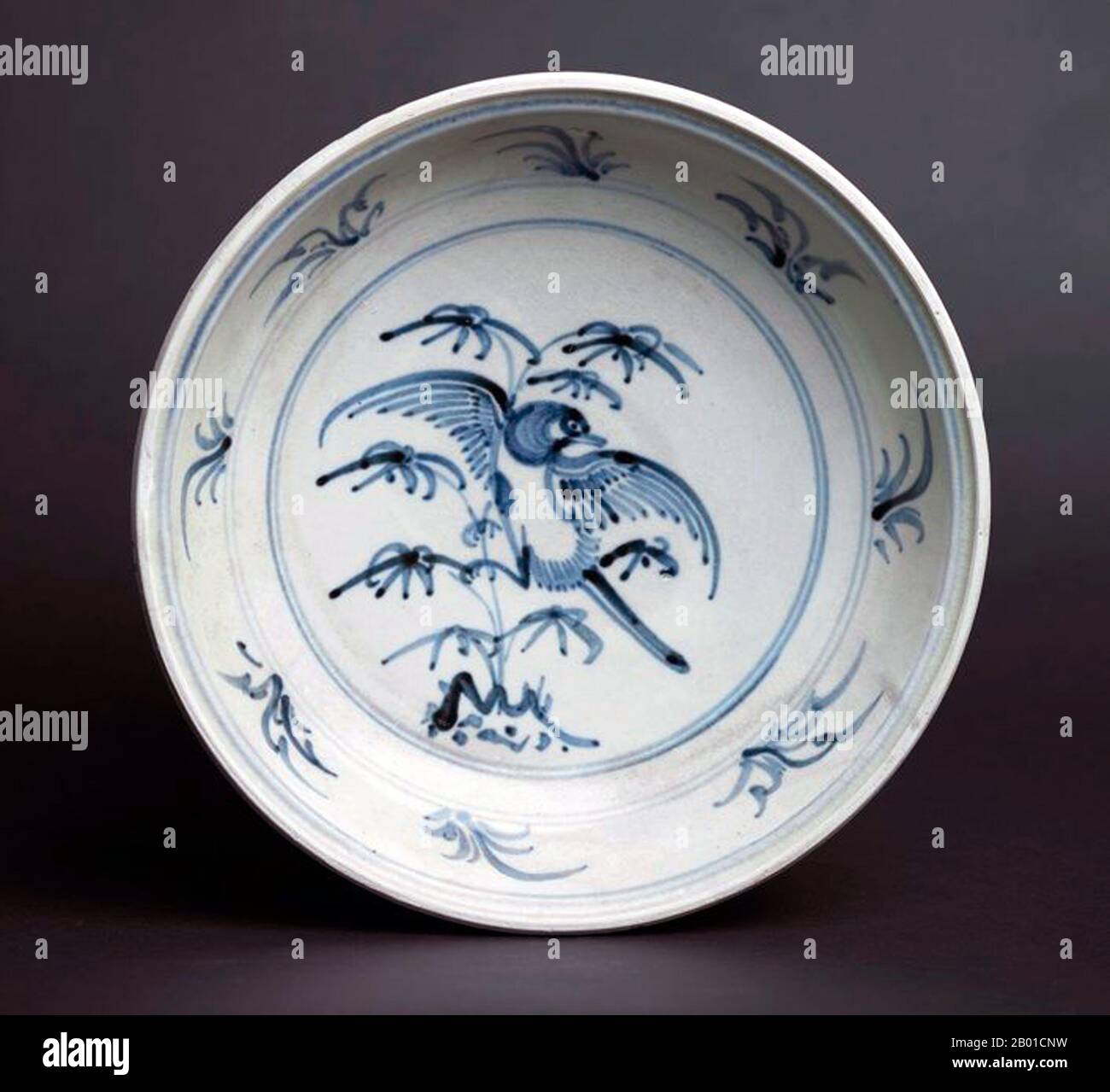 Vietnam: Blue and White Bird Plate with depiction of a single bird amid branches. Later Lê Dynasty (1533-1788).  Bát Tràng porcelain and pottery is a type of ceramics made in the village of Bát Tràng, in the suburban outskirts of the northern Vietnamese city of Hanoi. The village is located in an area rich in clay suitable for making fine ceramics.  Bát Tràng ceramics are considered some of the best known porcelain products in Vietnam besides those of Chu Đậu, Đồng Nai, Phu Lang, and Ninh Thuận. Stock Photo