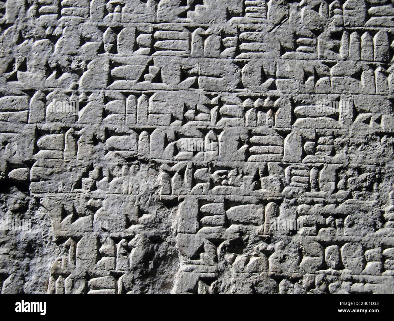 Iraq: Detail of Akkadian cuneiform wedge writing, c. 2500 BCE.  Cuneiform script is one of the earliest known forms of written expression. Emerging in Sumer around the 30th century BC, with predecessors reaching into the late 4th millennium (the Uruk IV period), cuneiform writing began as a system of pictographs. In the three millennia the script spanned, the pictorial representations became simplified and more abstract as the number of characters in use also grew gradually smaller, from about 1,000 unique characters in the Early Bronze Age to about 400 unique characters in Late Bronze Age. Stock Photo