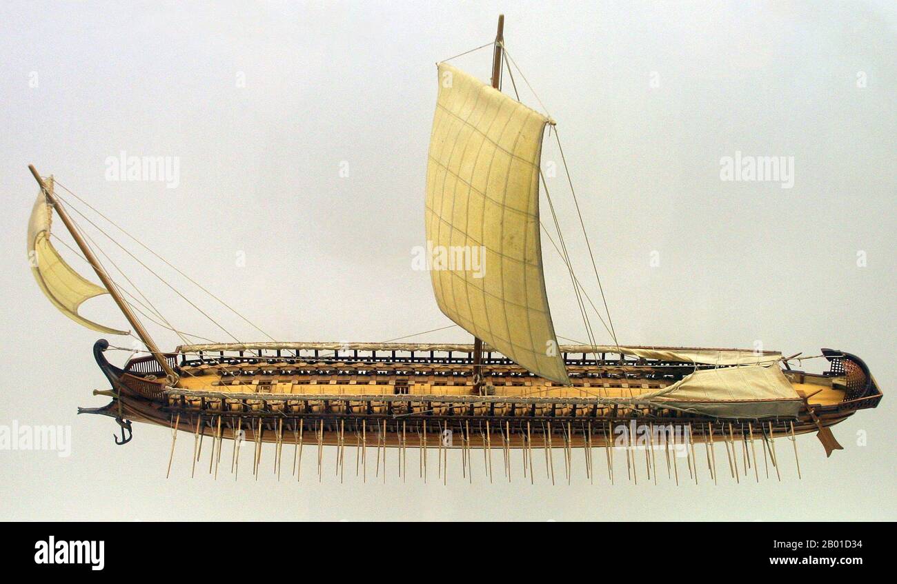 Greece/Iran: Model of a trireme or rowed warship used by Phoenecians, Greeks, Persians and Romans, especially c. 7th-4th centuries BCE. Photo by Matthias Kabel (CC BY-SA 3.0 License).  A trireme (from Latin triremis, literally 'three-oarer') was a type of galley, a Hellenistic-era warship that was used by the ancient maritime civilisations of the Mediterranean, especially the Phoenicians, ancient Greeks, Persians and Romans.  The trireme derives its name from its three rows of oars on each side, manned with one man per oar. The early trireme was a development of the penteconter. Stock Photo