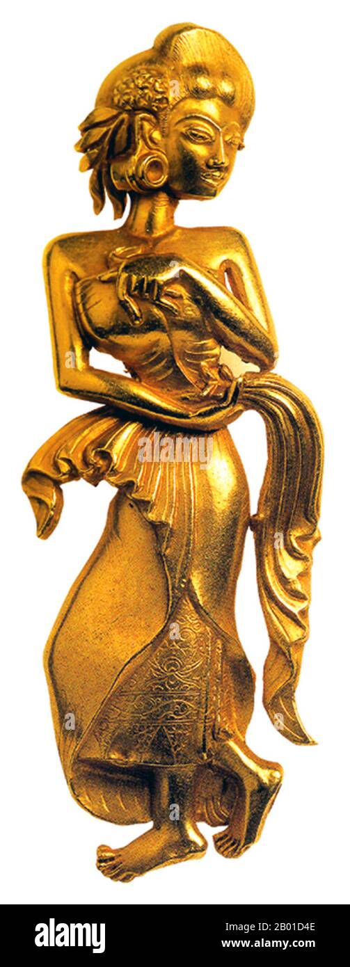Indonesia: The 'Bidadari Majapahit', a golden apsara figure from the Majapahit Era (1293-1500), Java,  9.2 cm high. Photo by Gunkarta (CC BY-SA 3.0 License).  The graceful Bidadari Majapahit, golden celestial apsara perfectly represents 'the golden age' of the Majapahit Empire. Javanese tradition holds that these beautiful celestial maidens living in Indra's heaven may descend according to Indra's will, to seduce ascetics in order to prevent their becoming more powerful than the gods. Stock Photo