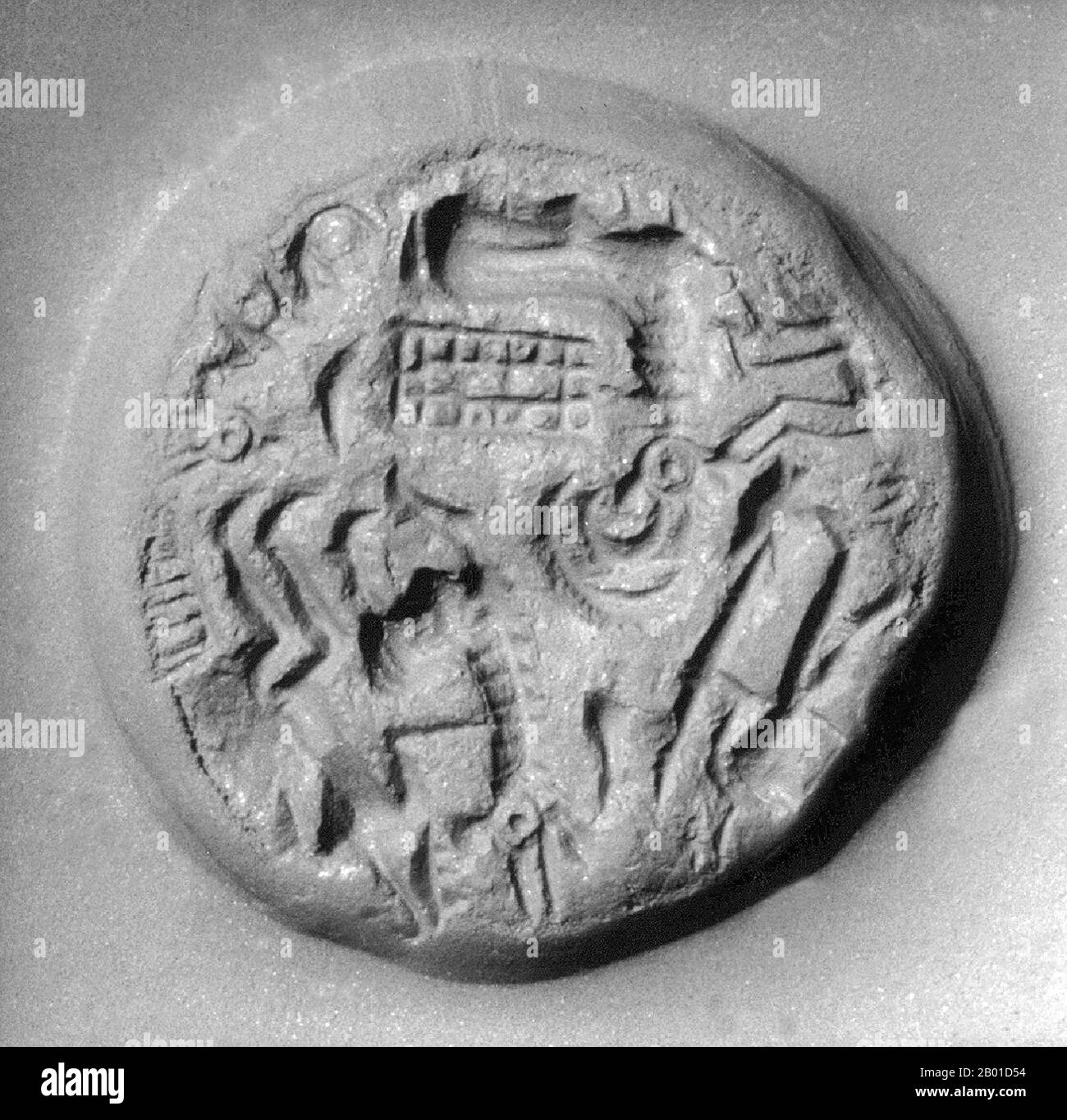 Arabian Gulf: Impression of a stamped seal from the Kingdom of Dilmun, probably on the western shores of the Arabian Gulf, c. 2000 BCE.  Dilmun (sometimes transliterated Telmun) is a land mentioned by Mesopotamian civilisations as a trade partner, a source of the metal copper, and an entrepôt of the Mesopotamia-to-Indus Valley Civilisation trade route.  Although the exact location of Dilmun is unclear, it might be associated with the islands of Bahrain, the Eastern Province of Saudi Arabia, Qatar, the United Arab Emirates, Oman and the nearby Iranian coast of the Arab or Persian Gulf. Stock Photo